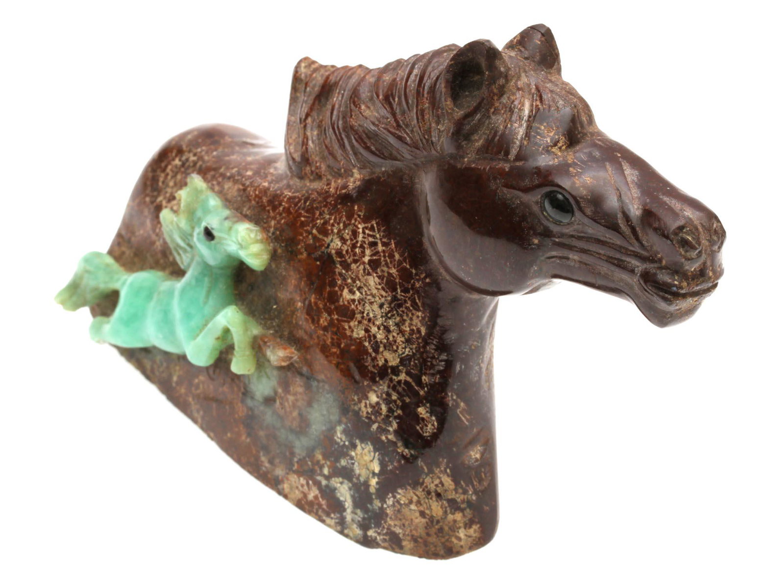 A VINTAGE CHINESE HAND-CARVED JADE FIGURINE: A figurine of a horse carved from jadeite of brown-green color. A full-length horse figurine is carved from the green part of the stone. The figurine is meticulously crafted and has a beautiful natura