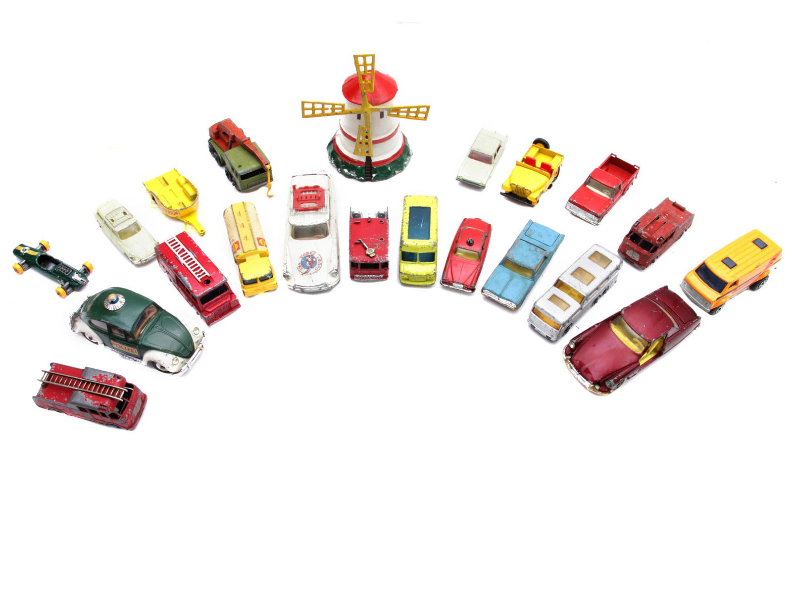 A SET OF VINTAGE CORGI TOY CARS AND OTHER: A set of 19 vintage toy cars and a toy mill. Most of the toy cars were made in England / Great Britain. Among the cars, there are models with a trailer. Dimensions: Smallest: 2 3/4 x 1 1/4 in.Largest: