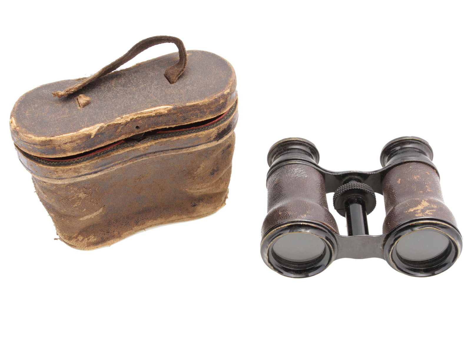 AN ANTIQUE FRENCH LAMIER PARIS OPERA GLASSES: An antique leather field opera glasses with an original leather case with silk lining. Marked on the rim LAMIER FABt PARIS. Circa 1900. Dimensions: 4 1/4 x 1 1/2 x 3 1/4 in.