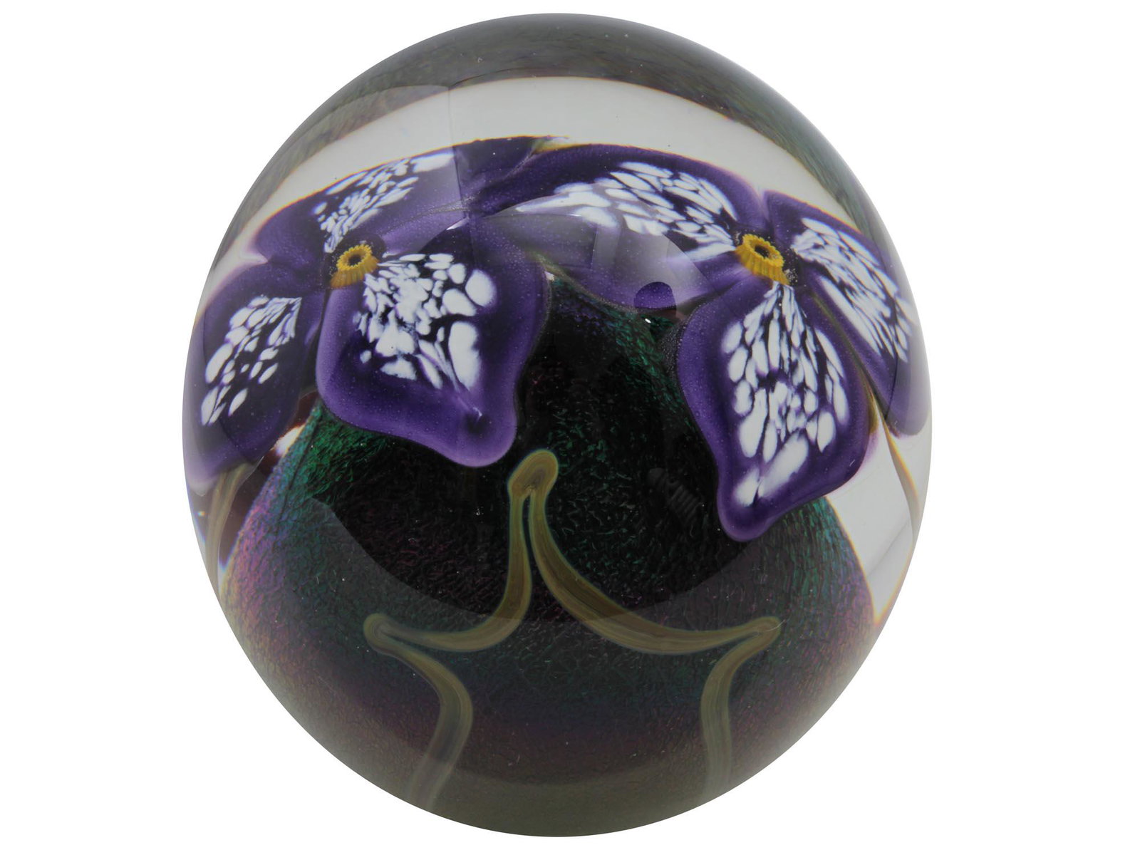 A ROBERT EICKHOLT ART GLASS PAPERWEIGHT 1999: A collectible vintage art glass paperweight by Eickholt Glass, Columbus, Ohio. Paperweight decorated inside with two blue flowers with white blotches on the petals, located on a green base, imitating 