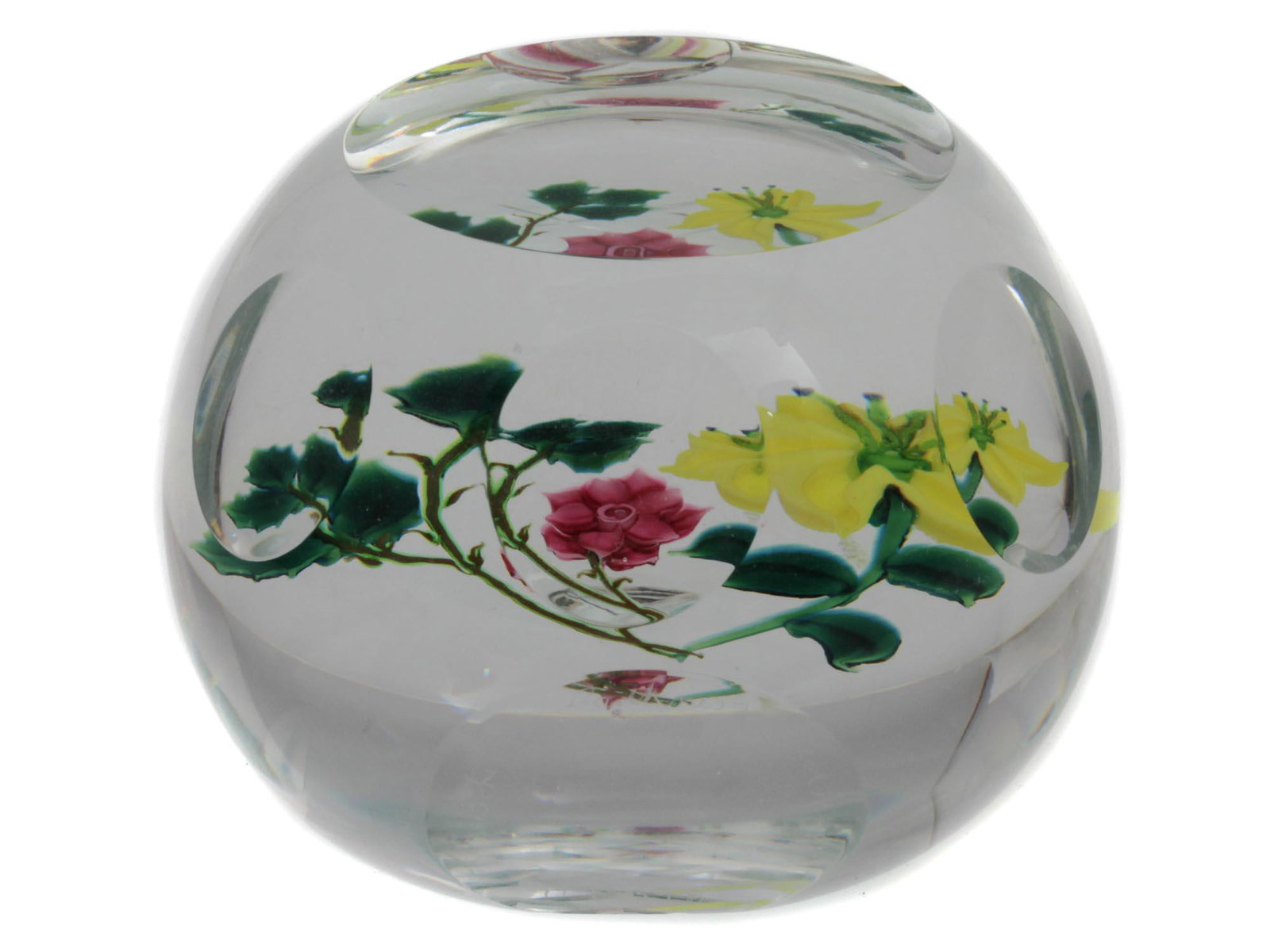 A CAITHNESS ART GLASS LA BOHEME PAPERWEIGHT: A hand-blown clear glass collectible paperweight "La Boheme" by Caithness Scotland. A faceted glass paperweight with a beautiful floral design. Etched on the base: "Caithness, Scotland, La Boheme" and
