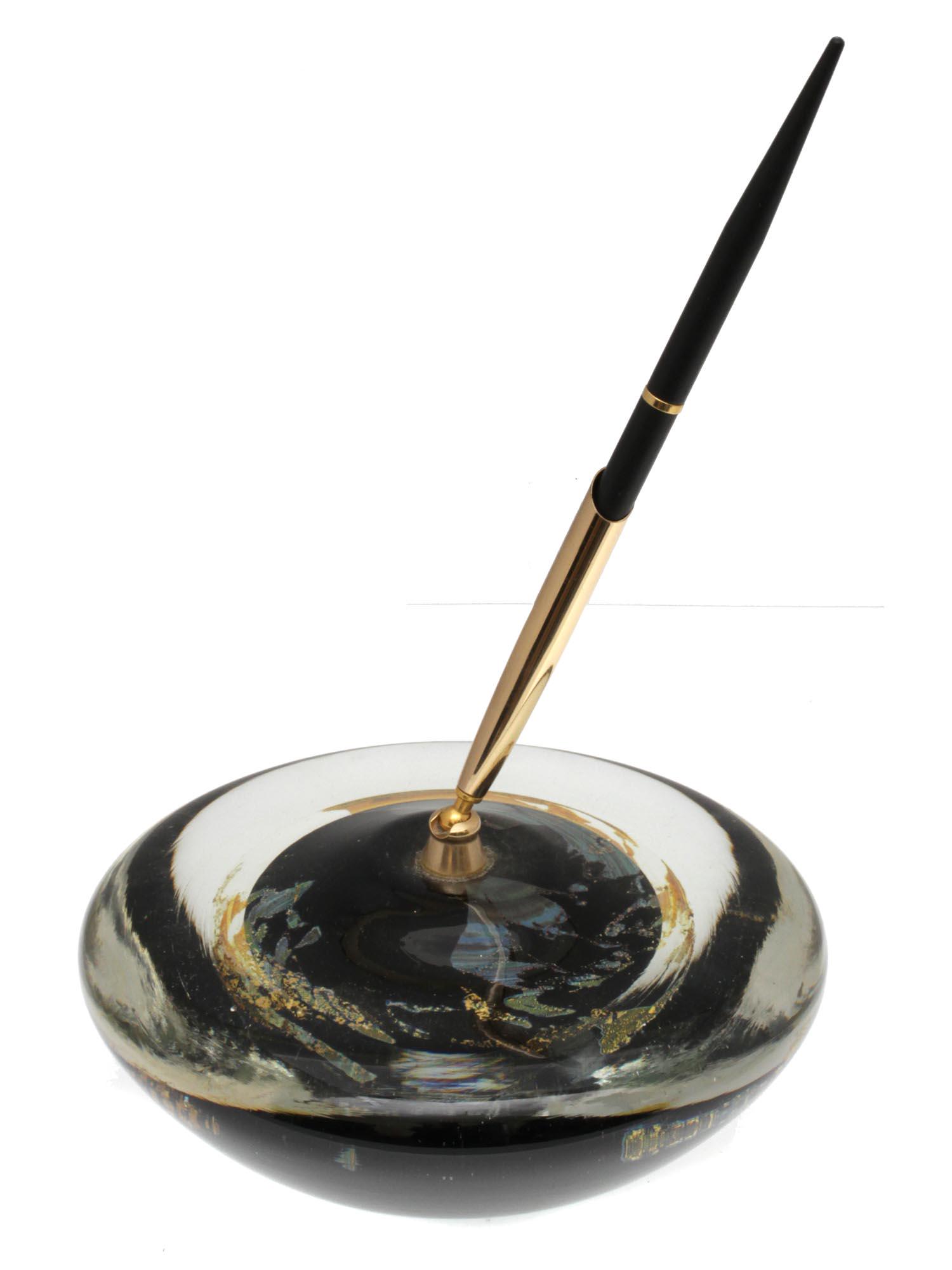 AN ART GLASS PAPERWEIGHT WITH PEN HOLDER: A hemispherical art glass paperweight with pen holder. On the bottom, there is the signature of the artist and the date. Dimensions: D: 5 3/4 in.H: 9 3/4 in.