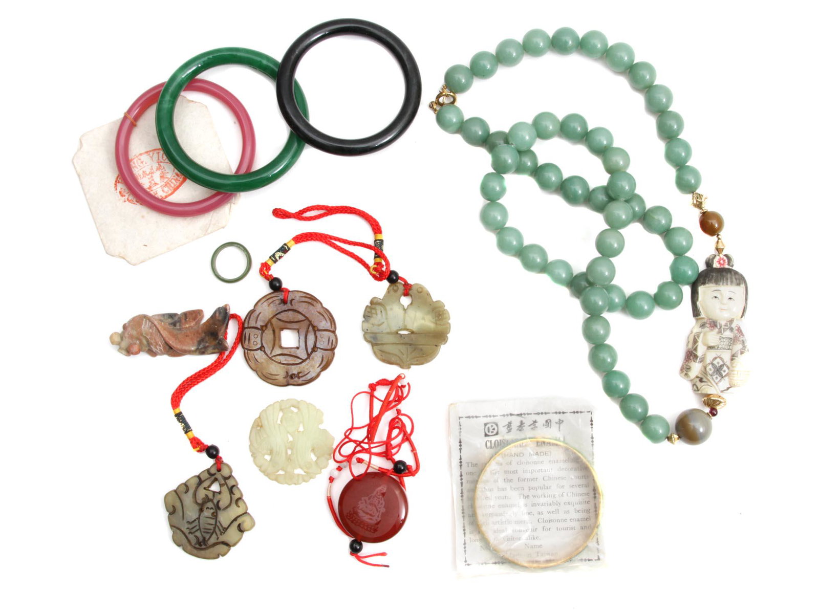A VINTAGE CHINESE CUSTOM JEWELRY WITH JADE PENDANT: A lot of vintage Chinese custom jewelry items. Included: jade bead necklace with netsuke pendant, three pink, green, and black glass bangle bracelets by Kwong Yick, Canton China, hand-made cloisonnÃ�