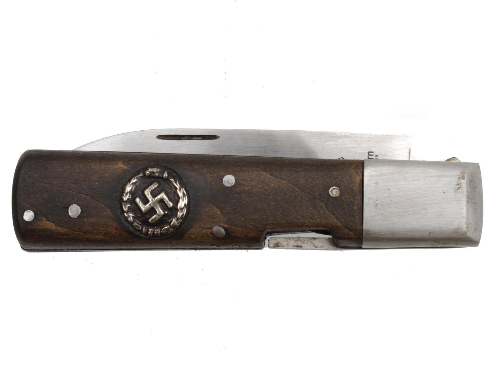 A WWII GERMAN THIRD REICH SS POLICE POCKET KNIFE: German WWII SS Police pocket knife by Eickhorn Solingen. This knife has a sharp blade with the maker's mark engraved on it. The handle is made of wood and has a Nazi swastika inlay. Dimensions: L: 4 i