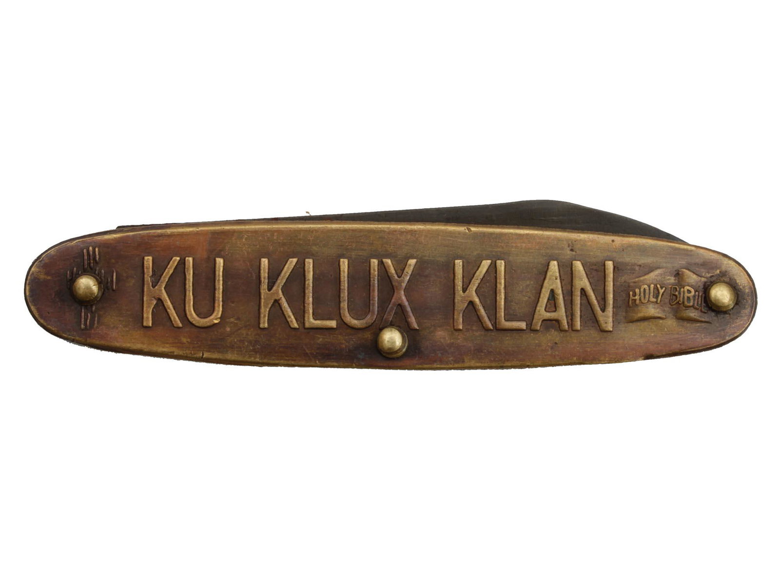 A VINTAGE KU KLUX KLAN POCKET KNIFE: A rare Brass knife embossed with Ku Klux Klan on one side and the image of hooded Klansman on the other. Probably produced during the Mid 20th Century.This item is sold as a historical collectible, we