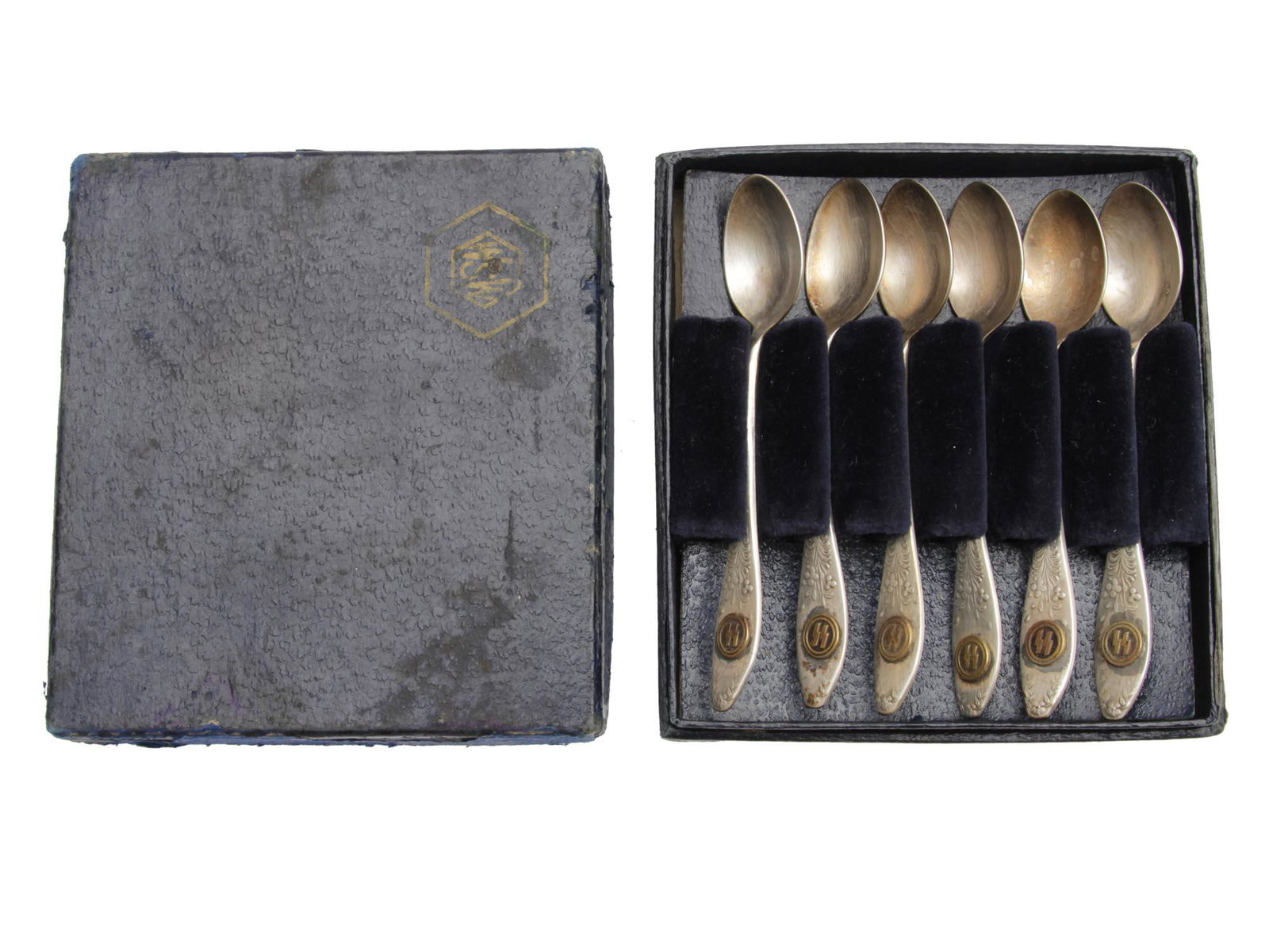 A WWII GERMAN WAFFEN SS OFFICER TEA SPOONS SET: This is a set of 6 German SS tea spoons from a Waffen SS officer's canteen. All of them have the SS runes embossed on the top part of the handle and each of them has the maker's mark on the reverse. I
