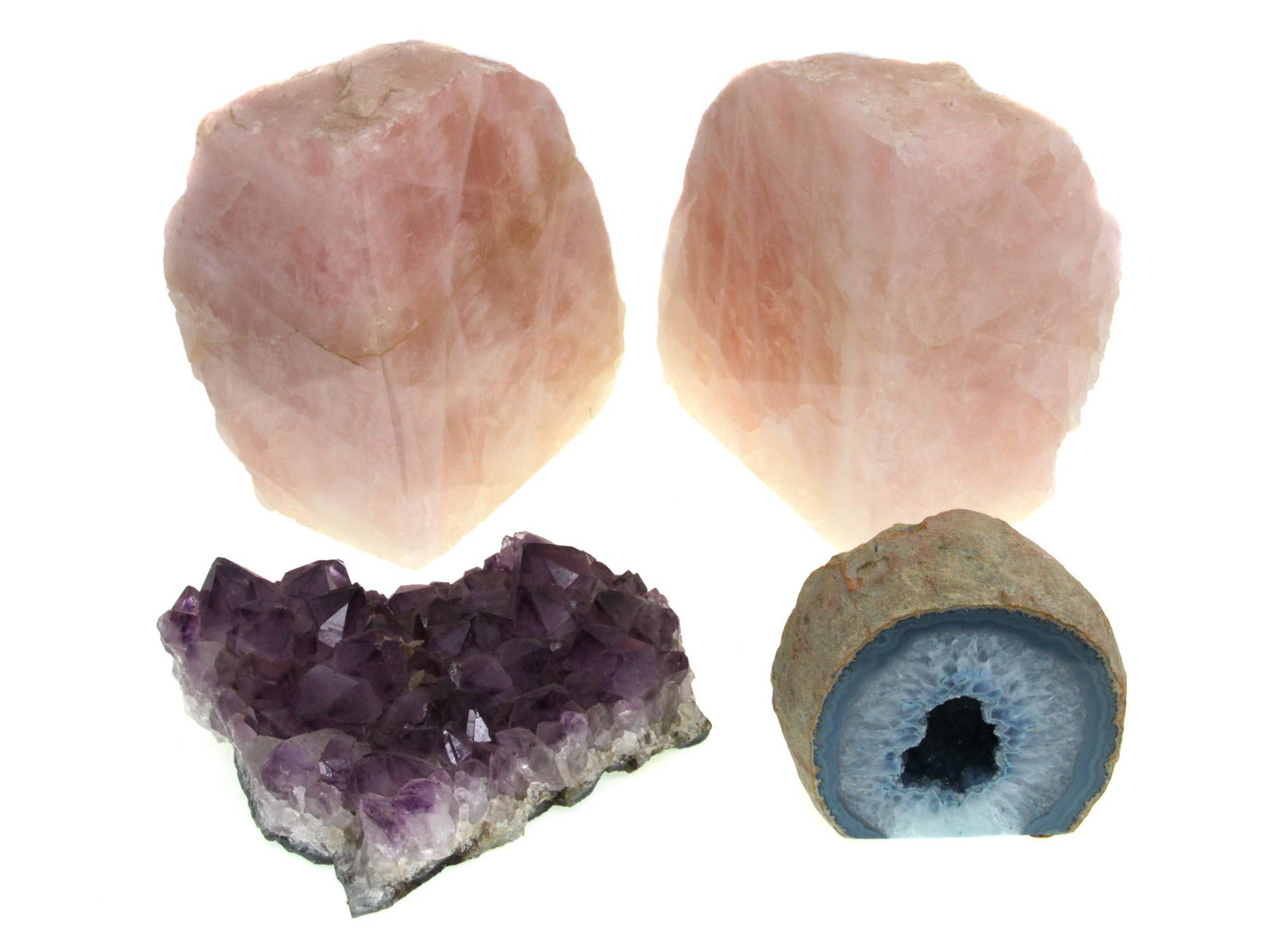 A SET OF LARGE NATURAL MINERALS 4 PIECES: A set of four natural minerals: blue agate geodes, amethyst crystal cluster, and two natural rose quartz, which can be used as bookends. Dimensions: Smallest H: 3 1/4 in.Largest H: 5 1/2 in.