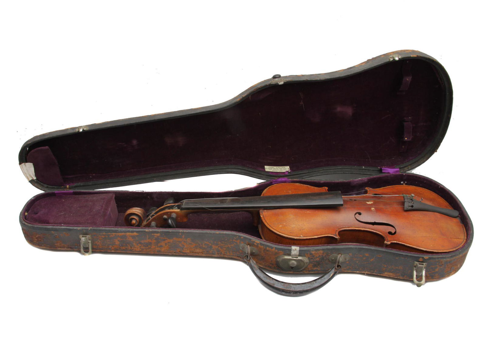 AN ANTIQUE AMERICAN VIOLIN BY CARL FISCHER: An early 20th-century violin with an original case upholstered in plum velvet. The case is labeled on the inside: Carl Fischer / Copper square, New York. / New England Branch / Boston, Mass. Dimension