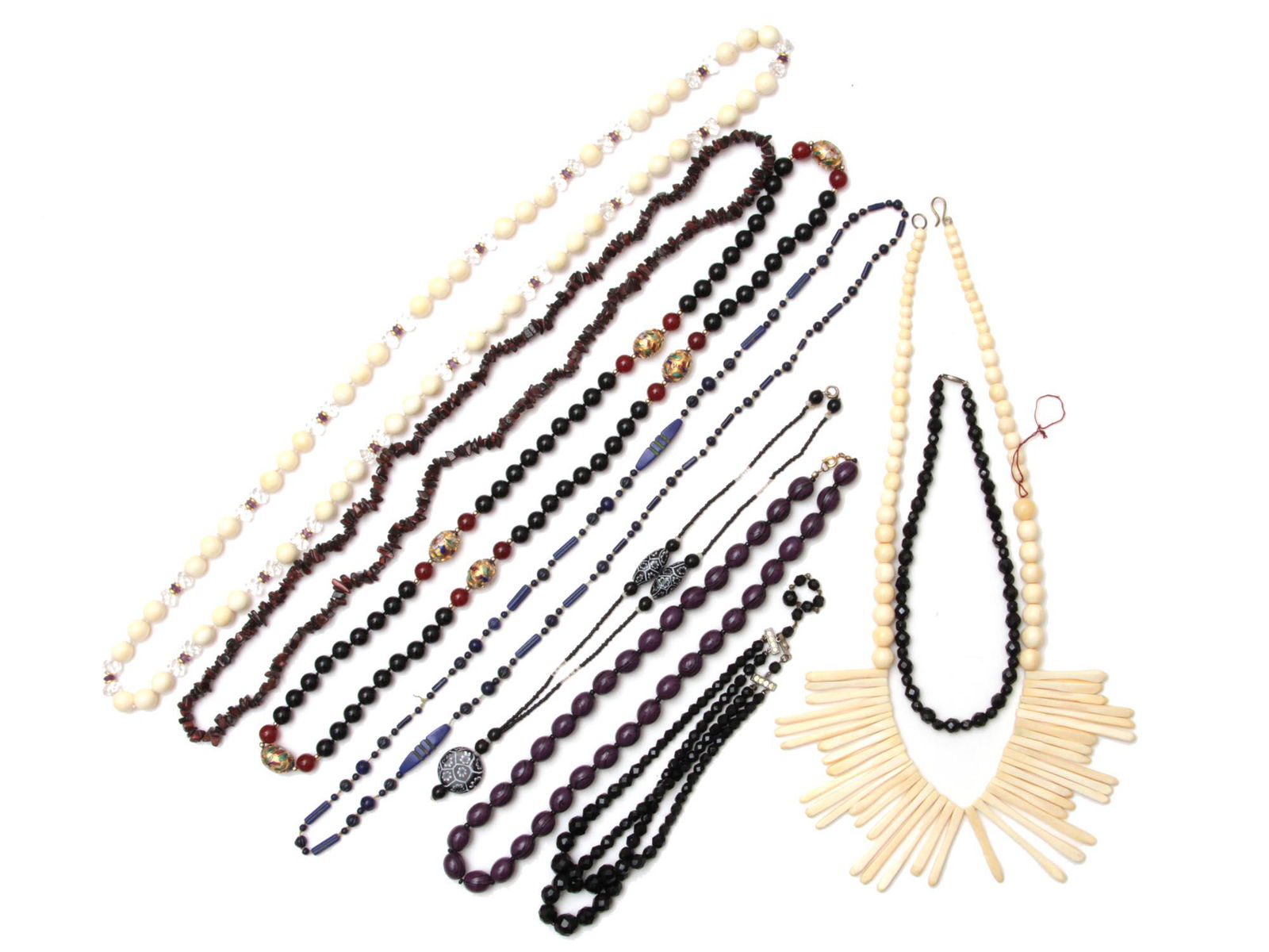 A LOT OF NINE ASSORTED JEWELRY NECKLACES: This is a lot of vintage jewelry. Included:A hand-painted wooden purple necklace, Tiger's Eye necklace, blue Lapis necklace, black and white necklace, faceted black Onyx necklace with silver clasp, a