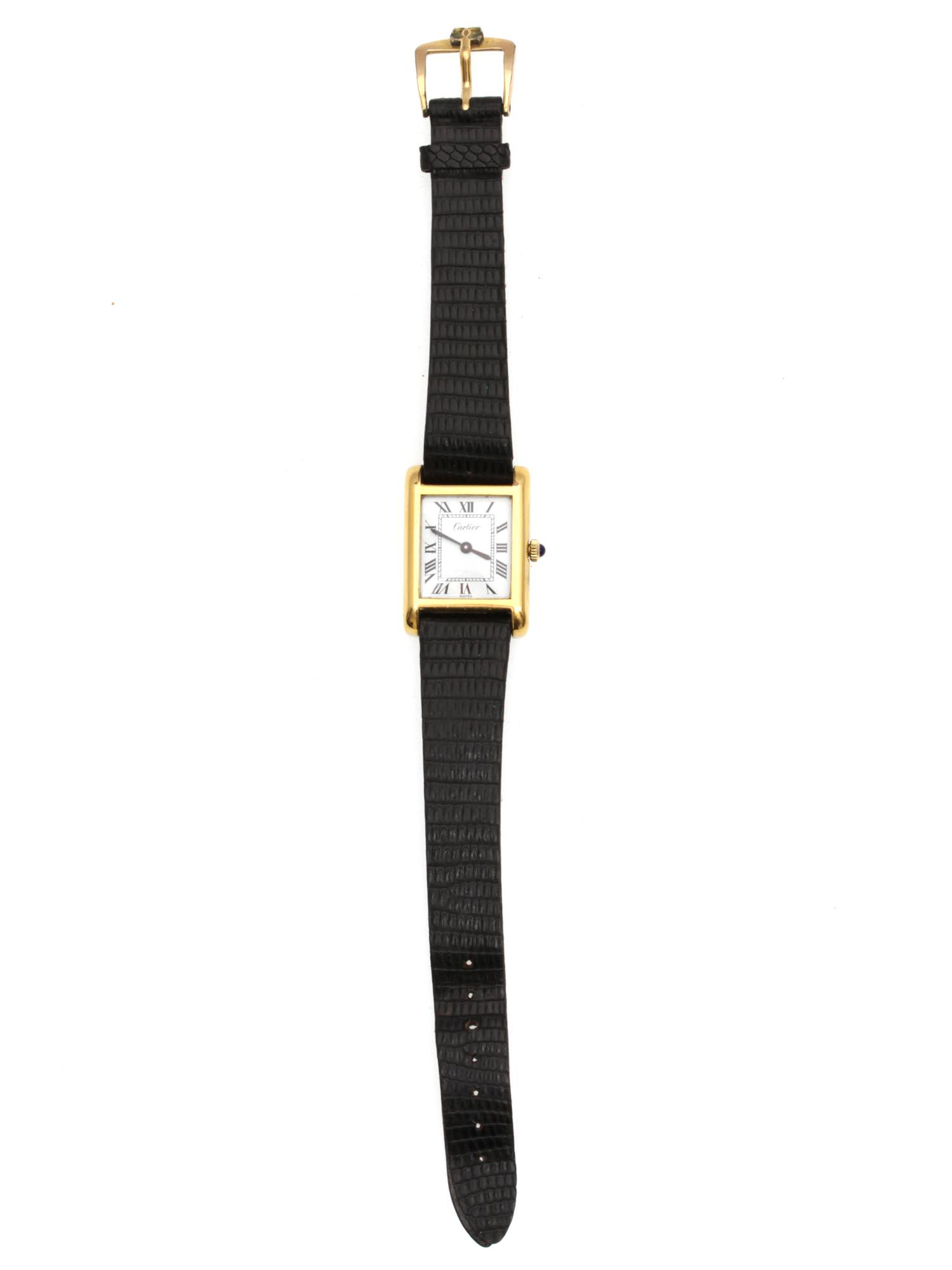 A CARTIER 18K GOLD ELECTROPLATED WRISTWATCHES: A vintage 18K gold electroplate unisex wristwatch from Cartier. Black Bengal lizard strap. The crown is decorated with a blue cabochon. Reverse engraving: Cartier / ELECTROPLATED / SWISS. Circa 1980's