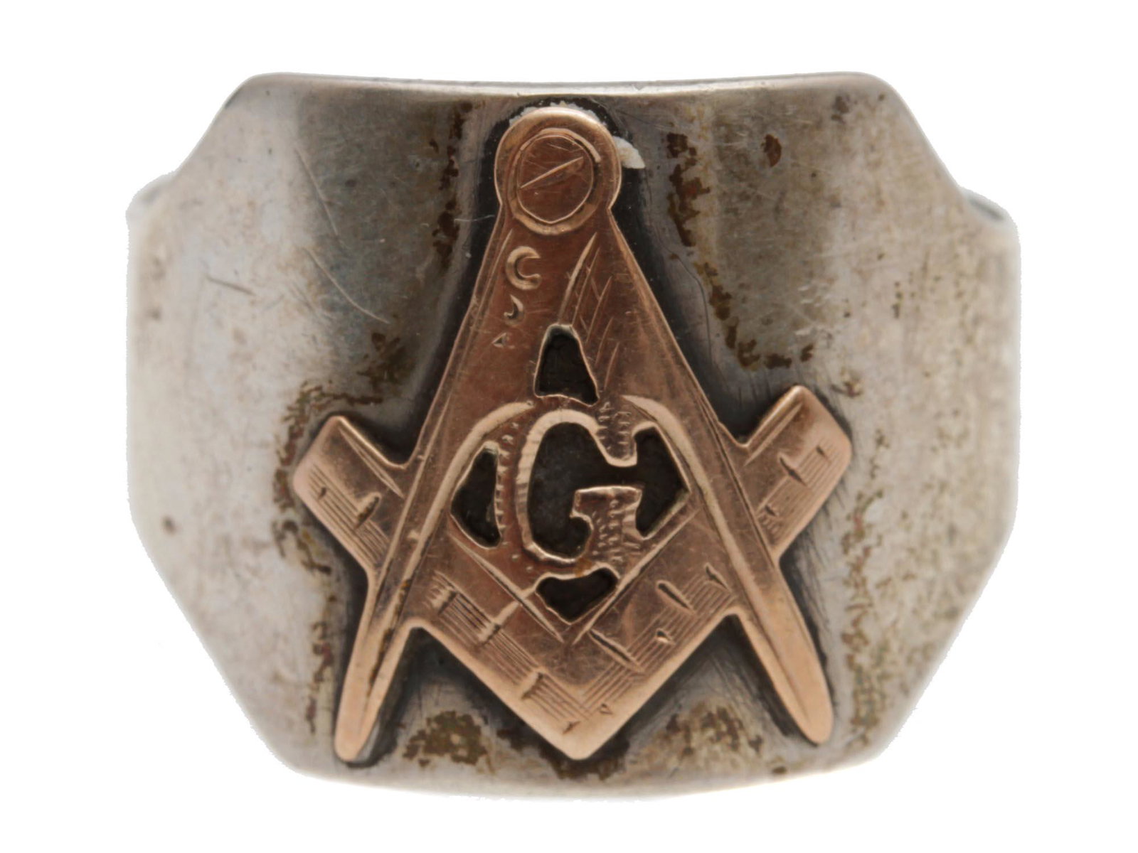 A MENS SILVER RING WITH GOLD MASONIC SYMBOL: A massive menâ€™s sterling silver ring decorated with a gilded masonic symbol depicting a square with a set of compasses. The letter G in masonic symbols has multiple meanings: God, Geometry, and