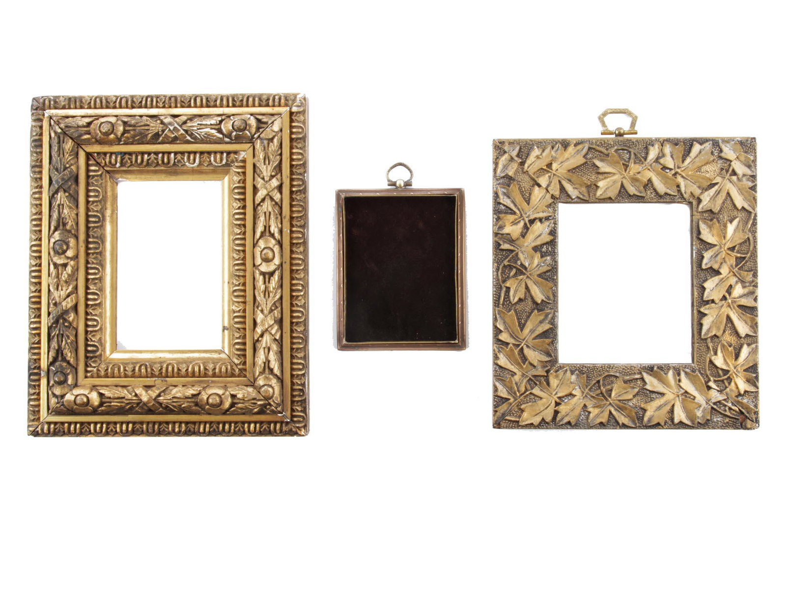 A LOT OF THREE ANTIQUE PHOTO FRAMES 19TH C: This set includes three 19th-century photo frames: one frame made of gilded wood with a detailed hand-carved convex pattern of flowers tied with ribbons. Another photo frame is metal (probably brass) 