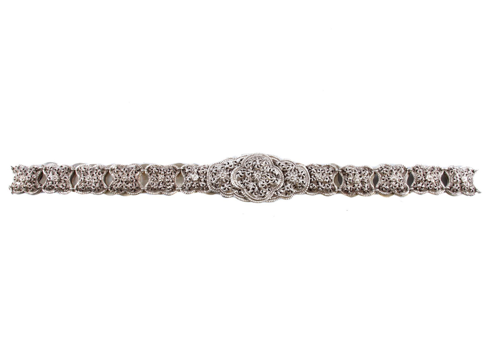A RUSSIAN CAUCASIAN SILVER BELT: A Russian silver belt composed of segments fastened together and adorned with openwork floral patterns. Marked on the back of the clasp with 84 silver standard and the initials of the master: BA.Weigh