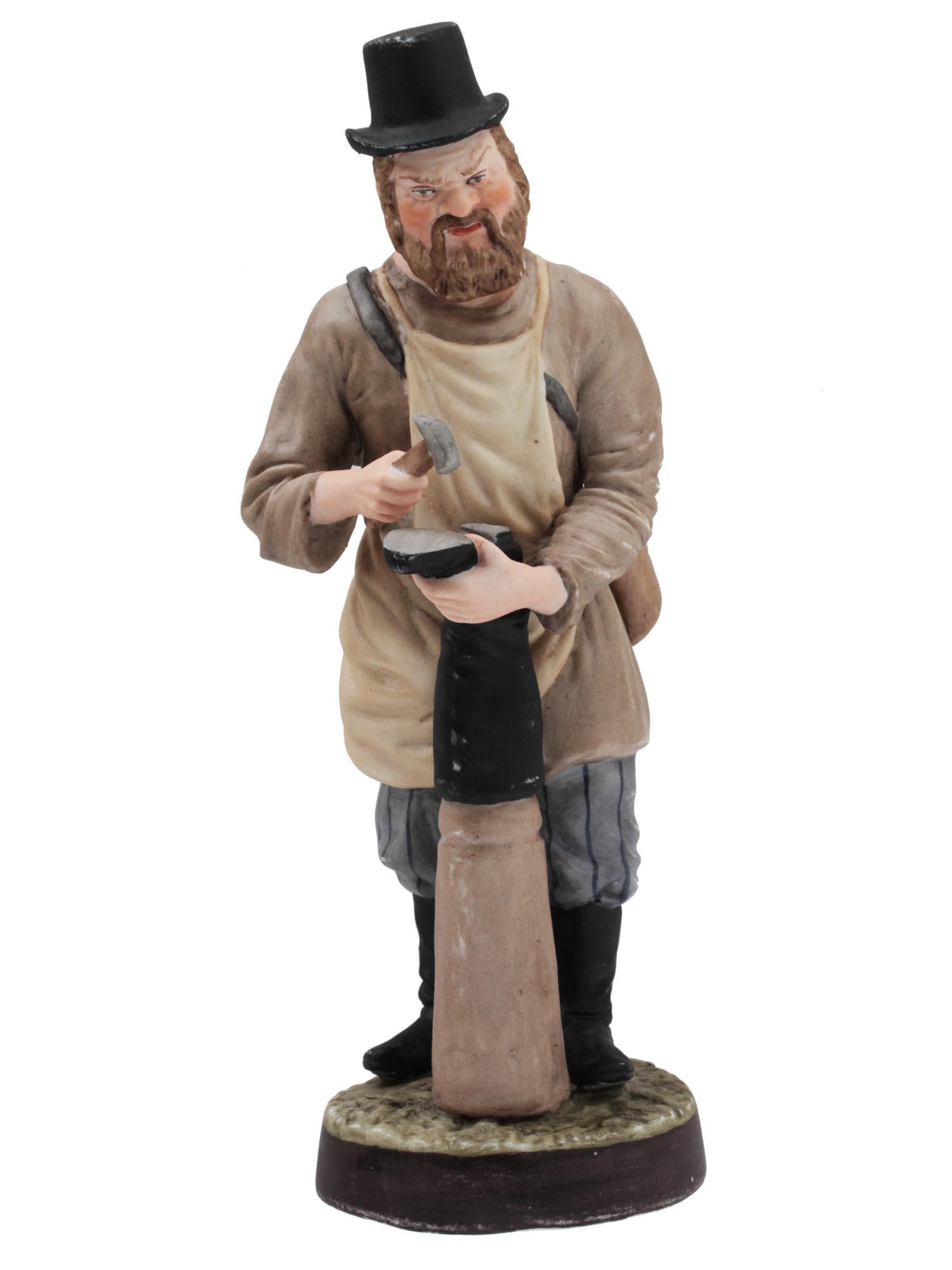 A RUSSIAN GARDNER PORCELAIN FIGURINE LATE 19TH C: An antique porcelain figurine of the Gardner Factory "The Shoemaker". Depicts a man in a gray shirt and an apron. Squinting, he punches the sole of the boot with a hammer. He has a craft bag over his 
