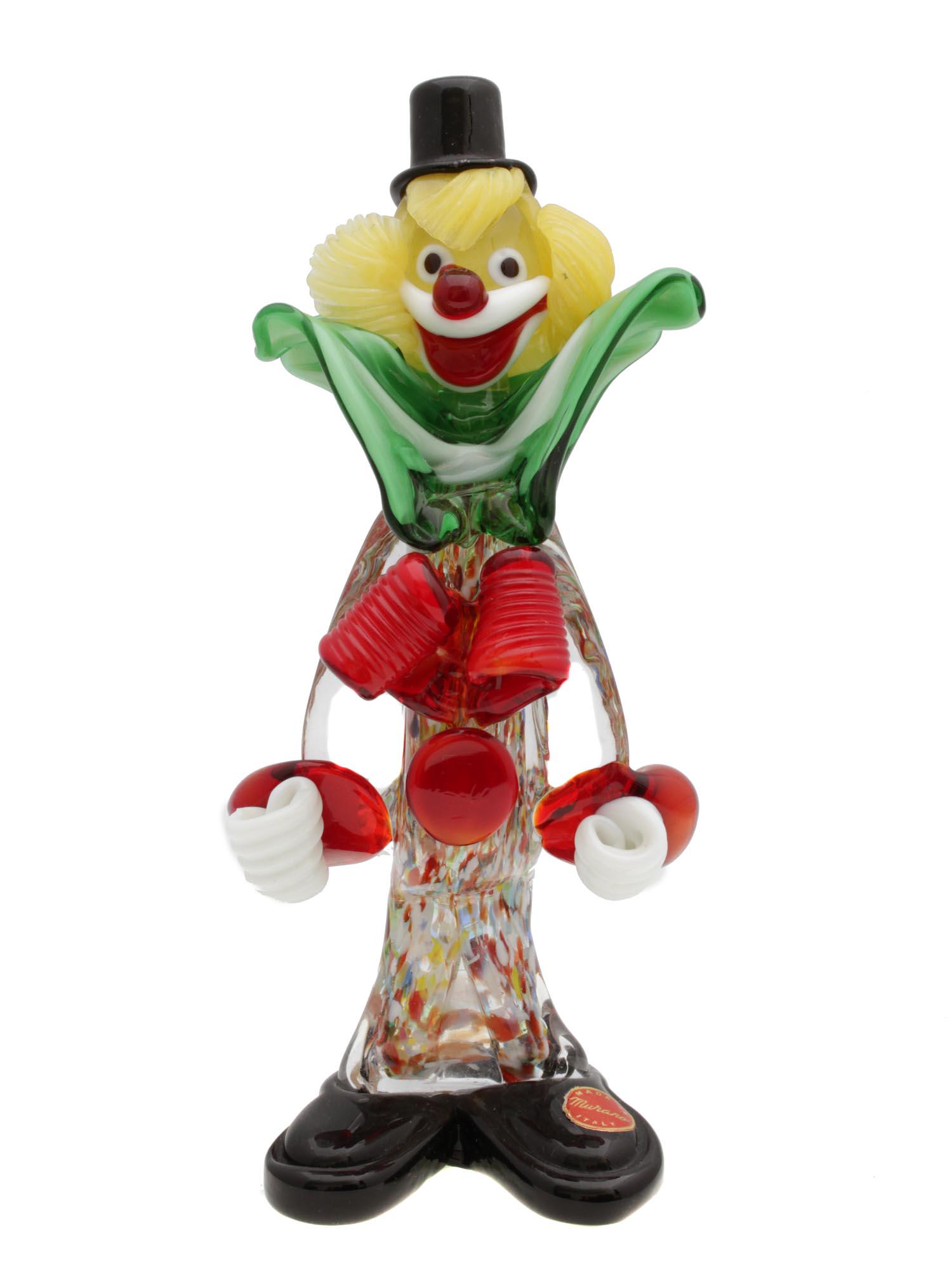 A VINTAGE MURANO GLASS CLOWN FIGURINE: A vintage collectible clown figurine designed by Murano, Italy. The figurine is hand-blown and has elegant shapes and bright colors. With an original Murano Glass sticker Dimensions: H: 8 1/8 in.