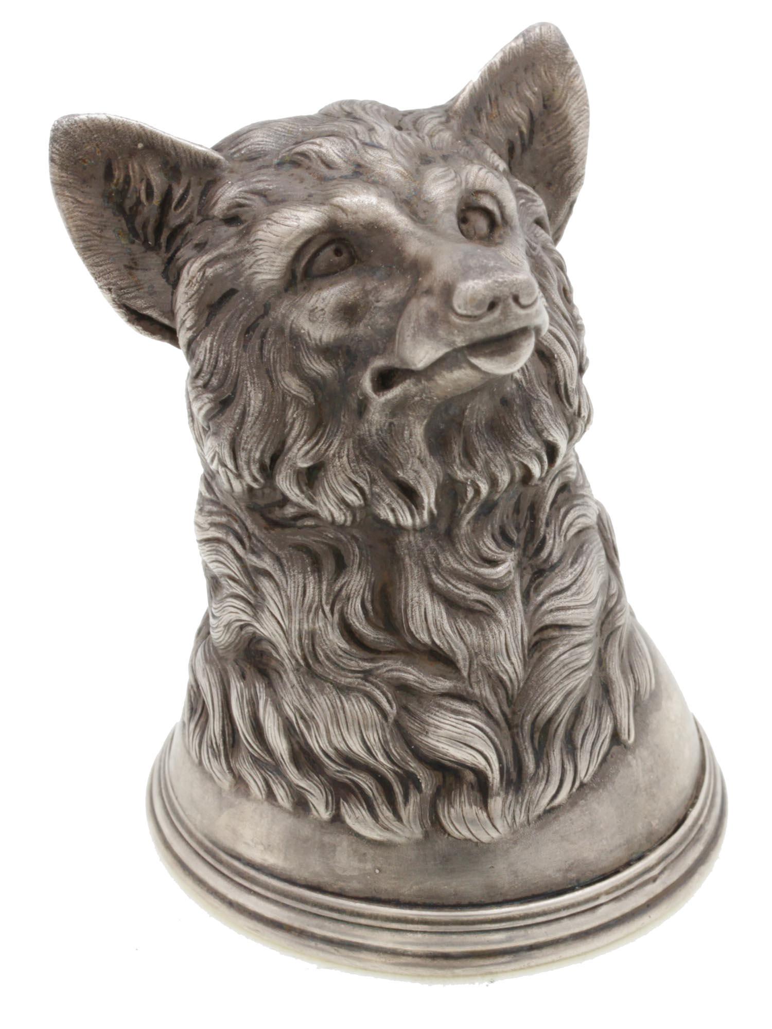 A RUSSIAN CARVED SILVER STIRRUP CUP DOG HEAD FORM: A Russian silver Stirrup cup with gilded interior and exterior in the shape of a stunningly detailed naturally carved dog head. Stamped with Russian hallmarks and marked 84 Silver and other Cyrillic a