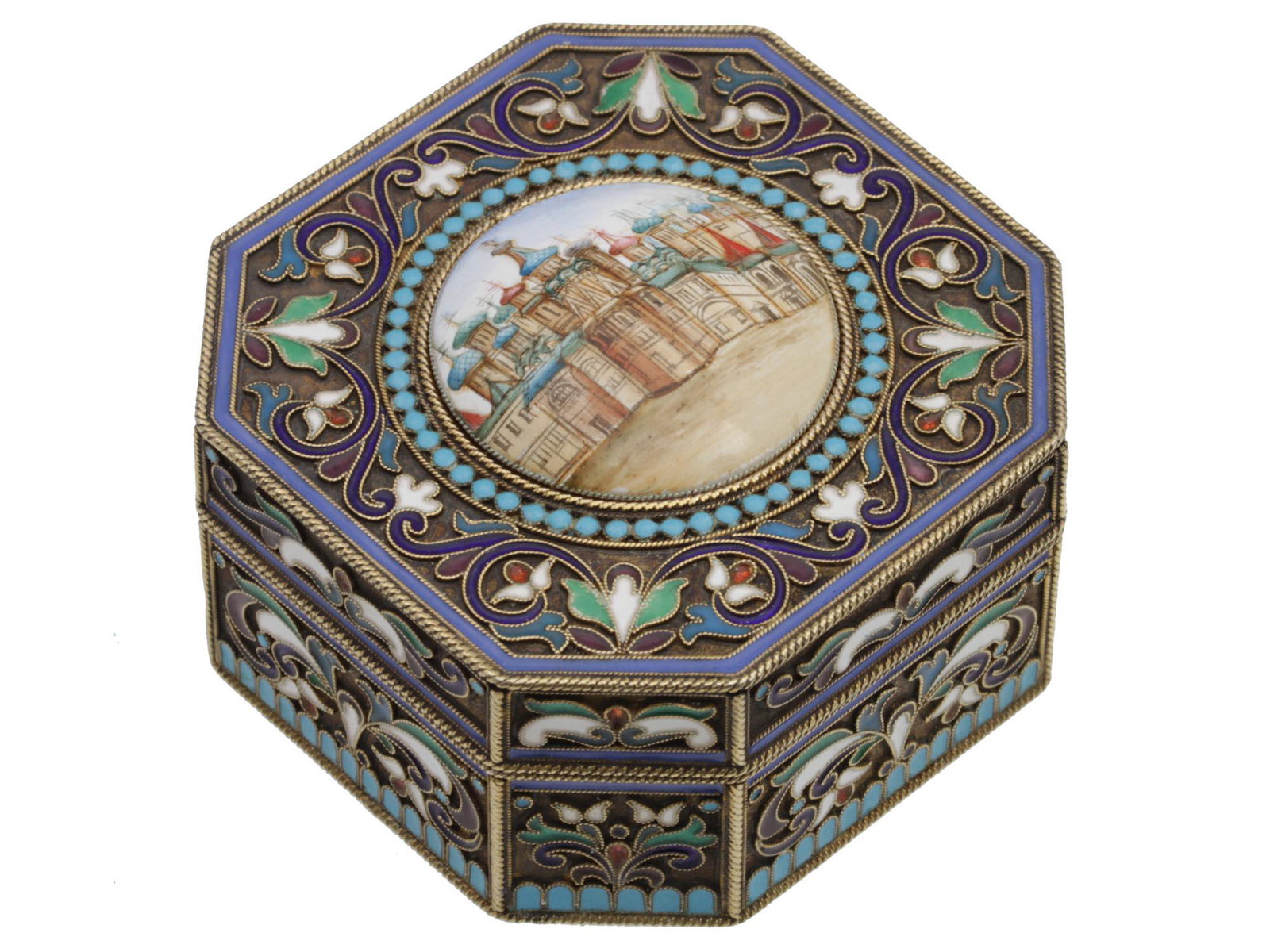 A RUSSIAN GILDED SILVER ENAMELED SNUFF BOX: A Russian snuff box made of 84 silver, with a gilded interior and admirable gilt-silver exterior with a dark base and blue, red, white, and green floral patterns made in cloisonnÃ© technique. There 