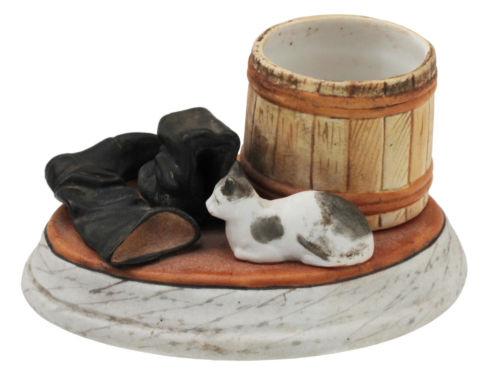 AN ANTIQUE SOVIET PORCELAIN MATCH HOLDER CA 1930S: An antique match strike and holder with a porcelain composition "A Tub, Boots and a Cat", made by the Dmitrov Porcelain Factory in Verbilki (formerly the Gardner Factory) after the model of the mid-19