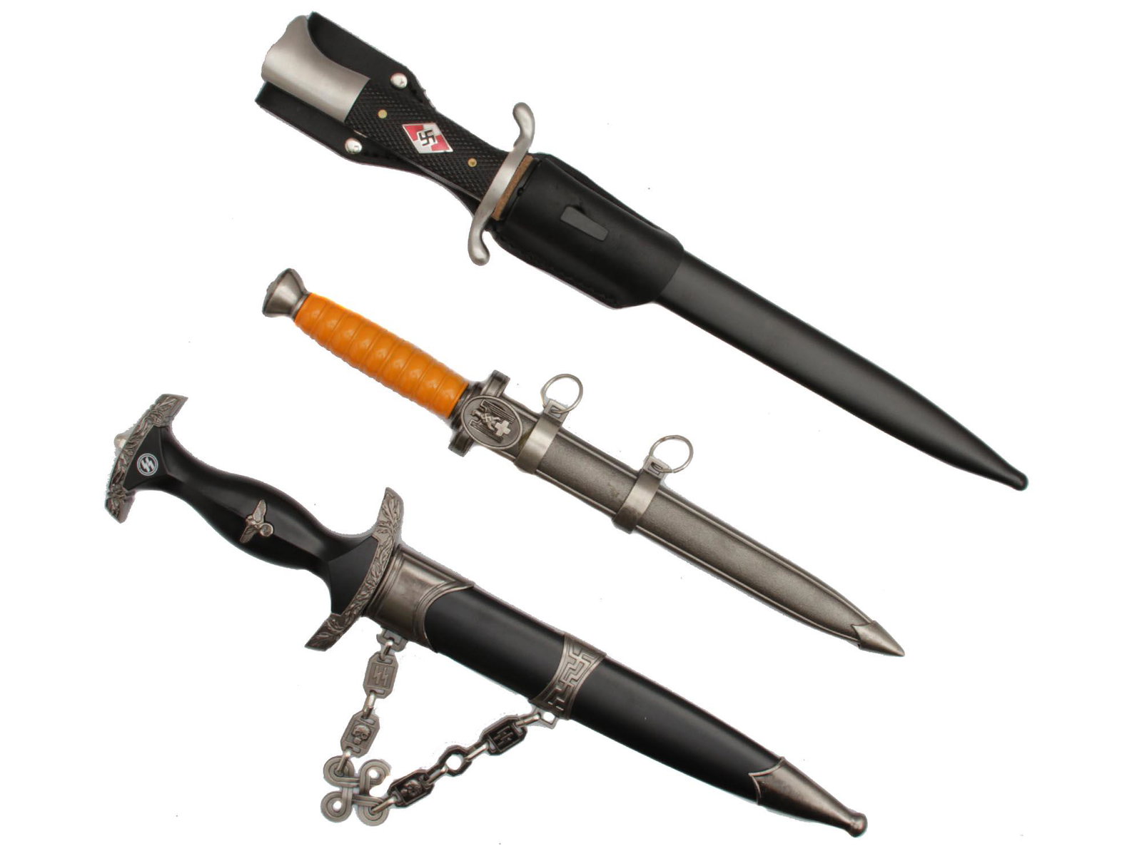 A LOT OF 3 GERMAN DAGGERS POST WWII PRODUCTION: A group of three German WWII daggers of post WWII production. The first one is The SS Third Reich dagger with SS eagle and SS lightning bolts runes on the black grip. The inscription on German - Alles