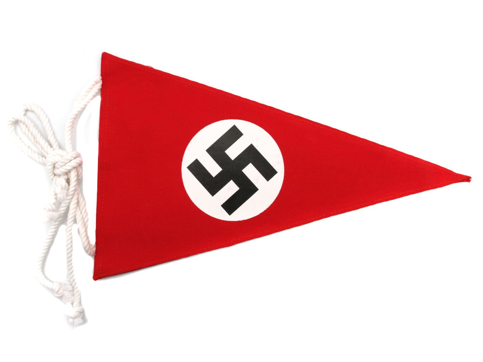 A WWII THIRD REICH NSDAP VEHICLE PENNANT: A German Third Reich WWII NSDAP official car pennant with a party flag. Red cotton triangle with white ropes for holding, with a white circle in the middle and a black rune of a fascist swastika place