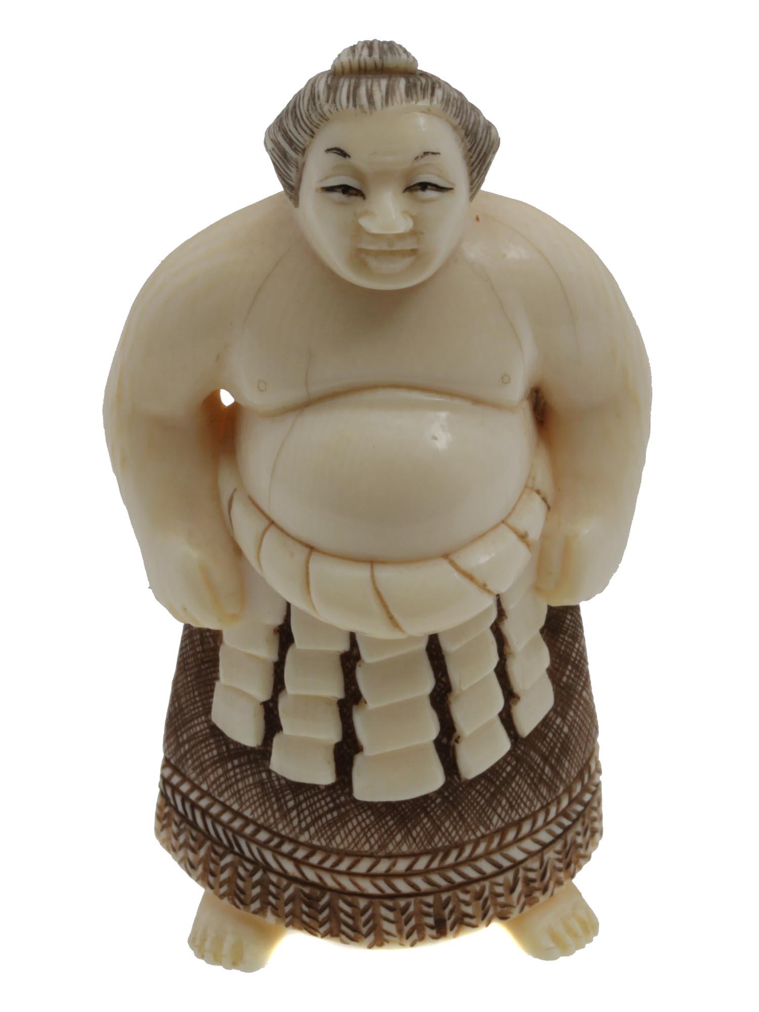 AN ANTIQUE JAPANESE CARVED NETSUKE: A fine Japanese carved netsuke, depicting a sumo wrestler. On the bottom, there is the master's hieroglyphic signature. Circa the early 20th-century. Dimensions: H: 2 3/4 in.