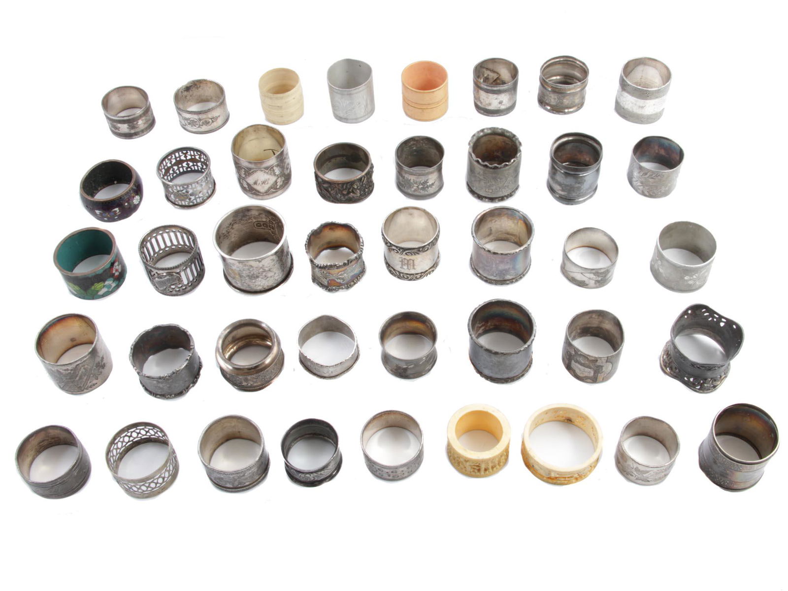 A LARGE SET OF ANTIQUE NAPKIN RINGS 41 PCS: The lot includes antique napkin rings from various manufacturers, circa the late 19th - early 20th century. Some are made from electroplated nickel silver, one of them is sterling silver; there are al