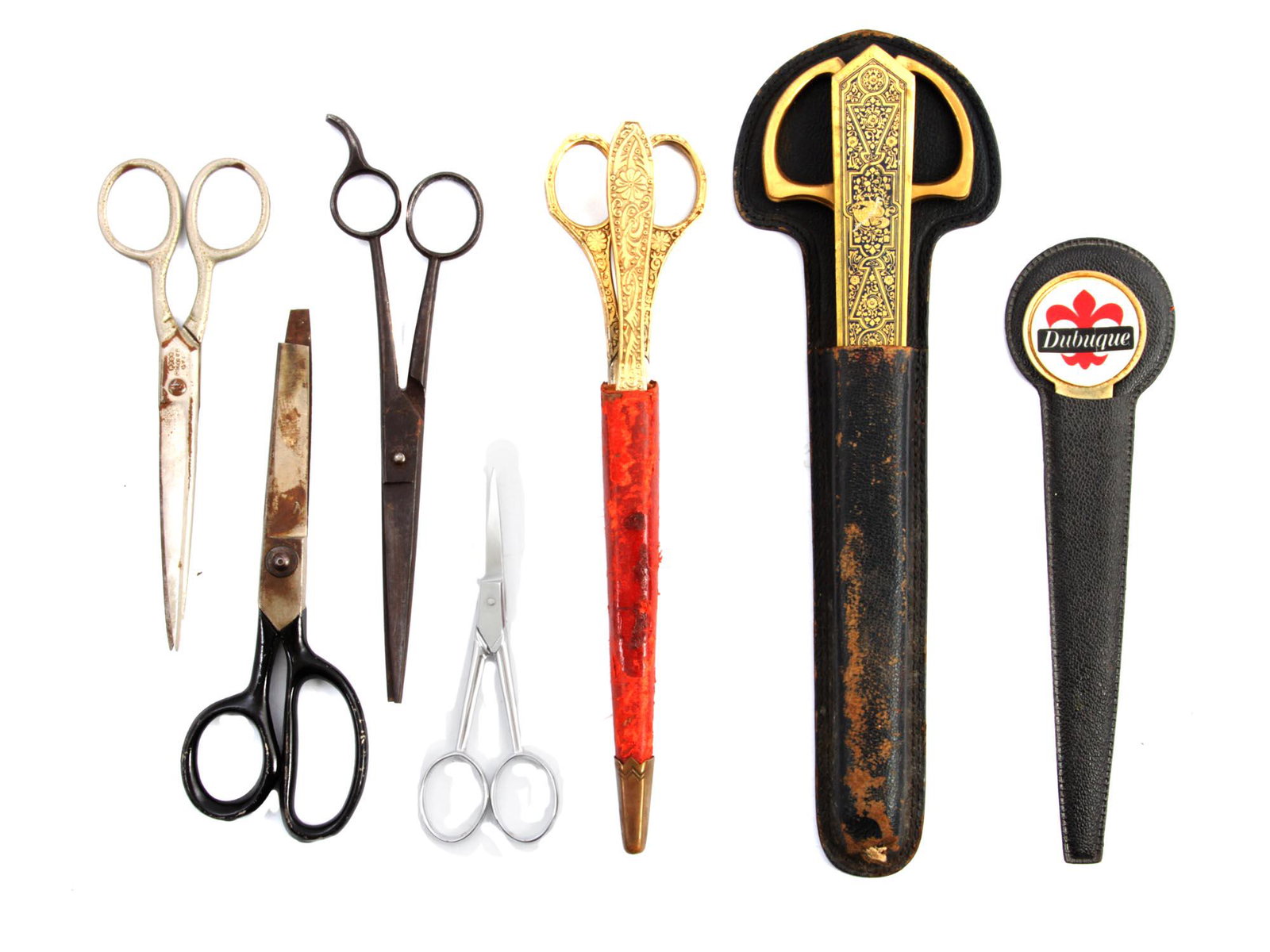 A SCISSORS AND LETTER OPENER GRASOLI WERK GERMANY: A lot of vintage craft and sewing scissors and letter openers. Included: three sewing scissors, one without the tip of the blades, small scissors, two marked sets of scissors, and letter knives from G