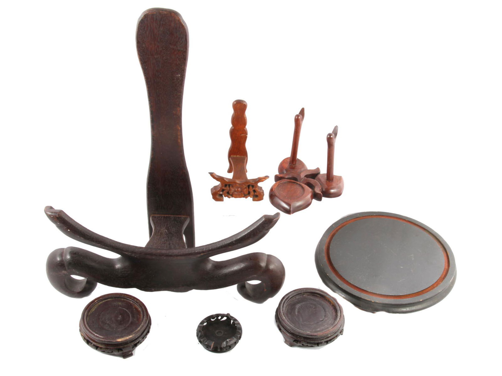A SET OF VINTAGE AND ANTIQUE CHINESE WOOD STANDS: A lot of vintage and antique Chinese different sizes and shapes wood stands. Dimensions: Smallest H: 4 1/2 in. Largest H: 19 in.