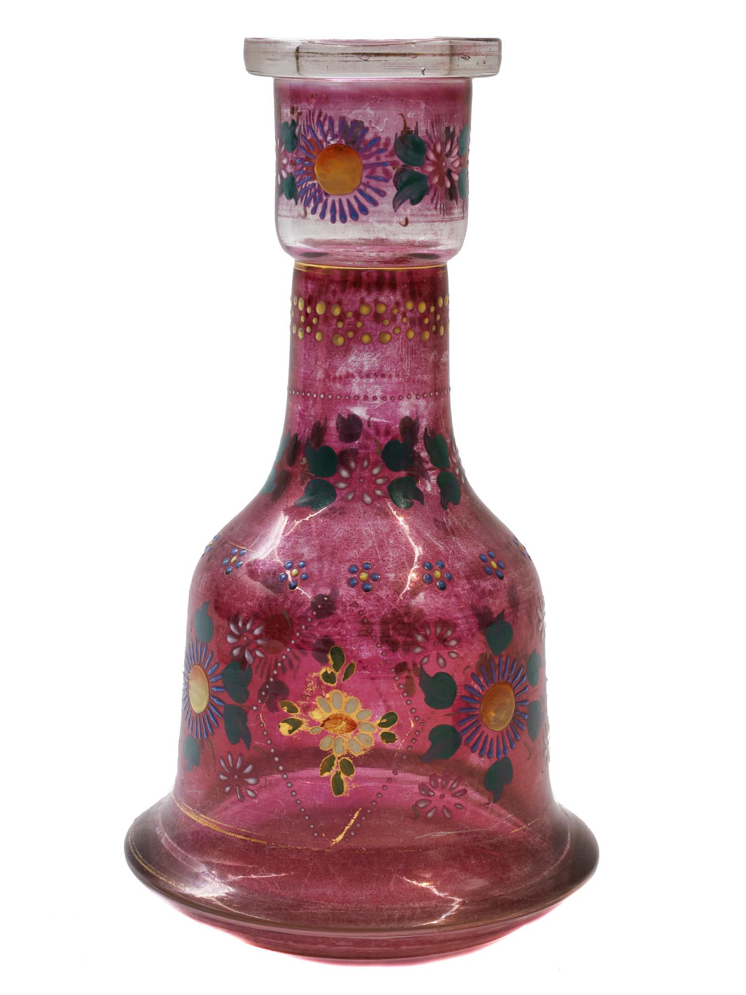 A PERSIAN BOHEMIAN ENAMELED GLASS HOOKAH BASE: An Antique Persian Bohemian glass hookah pink base with hand-painted enamel floral colorful decoration Circa 19th Century. Dimensions: H: 10 1/4 in., (26 cm.)