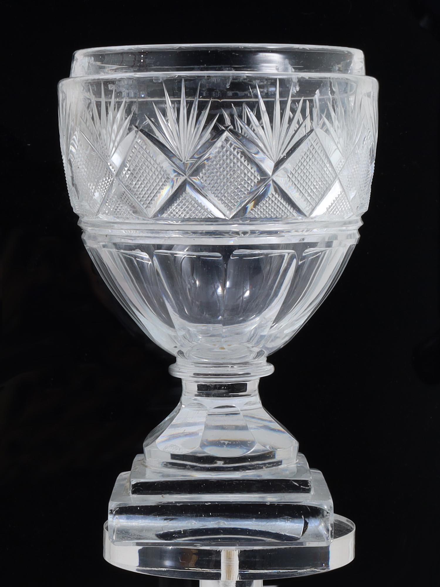 AN ANTIQUE RUSSIAN IMPERIAL CUT CRYSTAL GOBLET: Fine antique Russian faceted cut-crystal wine goblet with a square base. Made by the Russian Imperial Glass Factory, circa 1820. Dimensions: H: 7 1/2 in.
