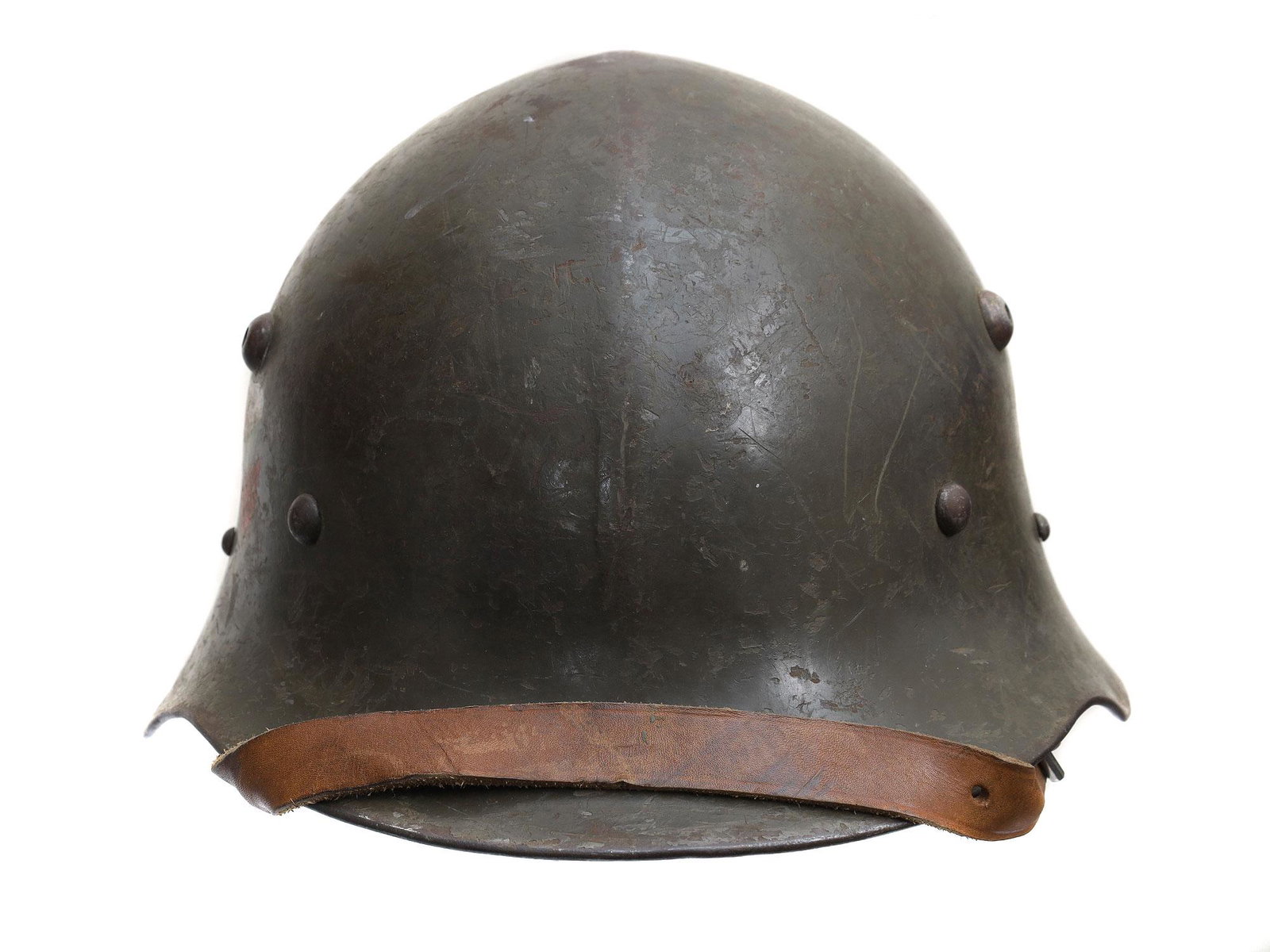 A VINTAGE BULGARIAN WWII HELMET: A WWII Bulgarian M36 helmet, with a painted insignia shield, liner, and chinstrap. The M36 was the standard-issue helmet of the Bulgarian Army during WWII. Dimensions: N/A