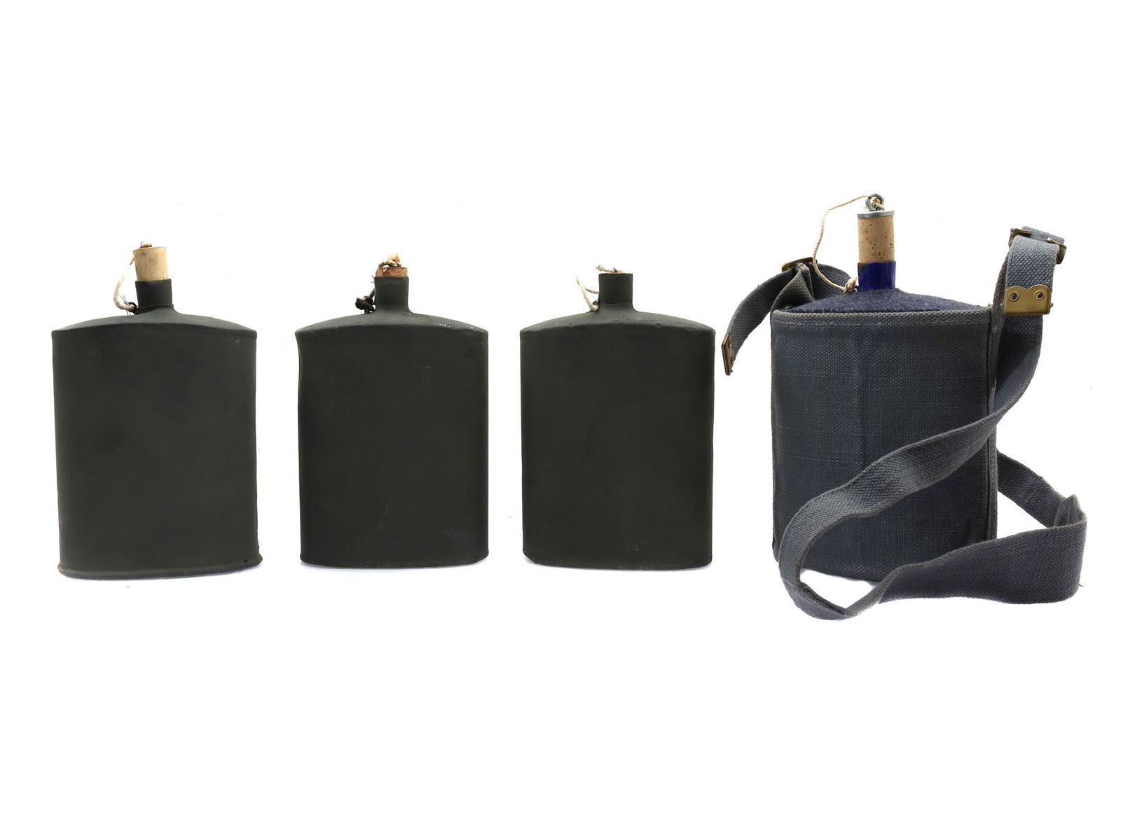A LOT OF FOUR MILITARY FLASKS OR CANTEENS, 20 C.: A lot comprised of three flasks, first half of the 20th century in their original case.