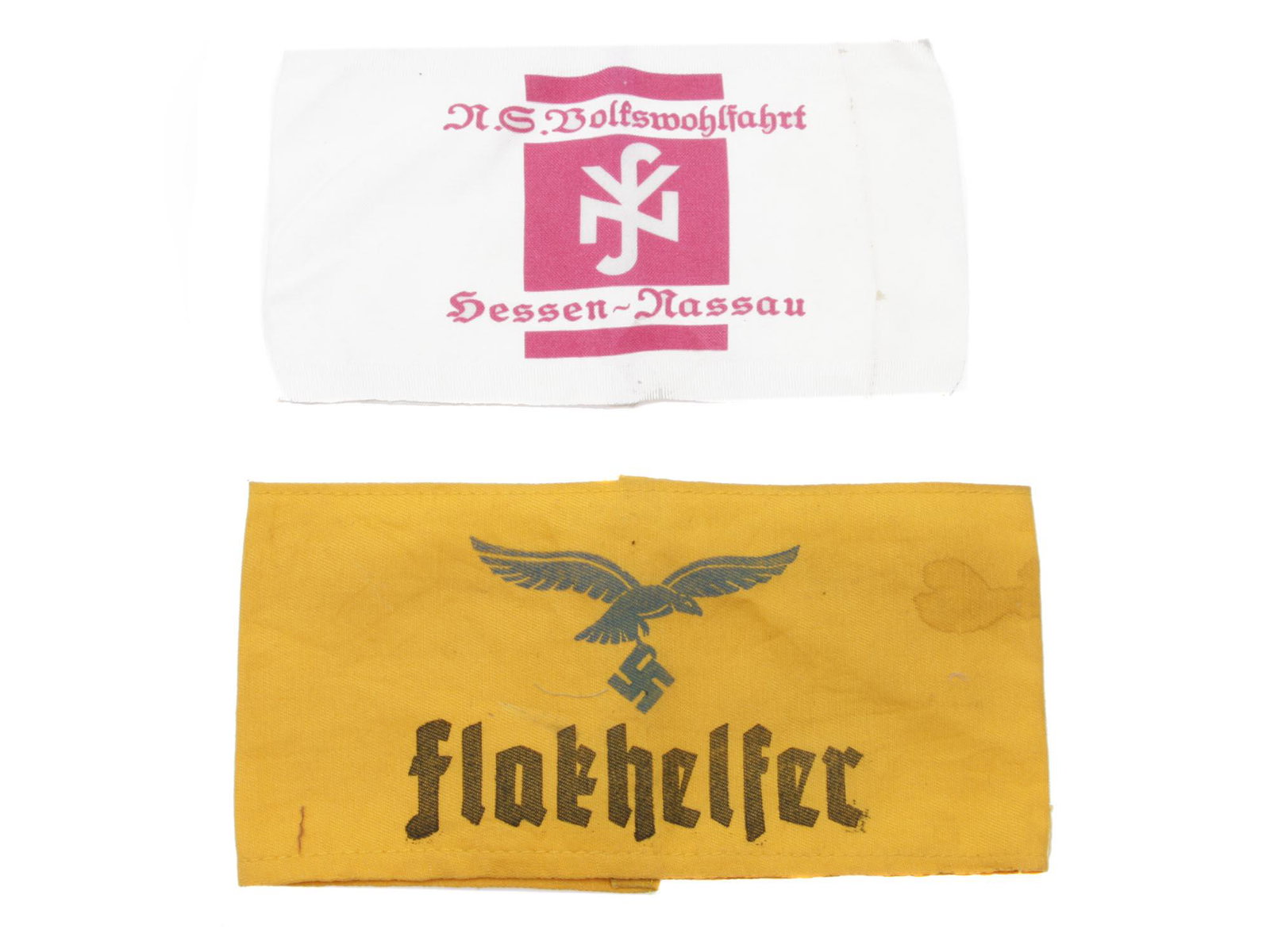 A WWII RARE GERMAN NAZI PAIR FLAKHELFER ARMBANDS: A WWII Rare German Nazi pair of armbands including white "P. G. Bolfswohlfahrt Dessen Passau", and yellow "Flakhelfer". Both with swastika insignia. Dimensions: Smaller L: 7 1/2 in. Larger L: 8 1/2 in