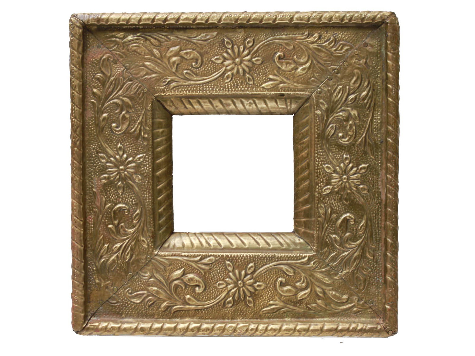 A VINTAGE SMALL SQUARE FRAME FLORAL RELIEF DESIGN: A vintage small square gilded frame decorated with relief floral pattern on the front and on the sides. Special hole at the back. Dimensions: 7 X 7 in.