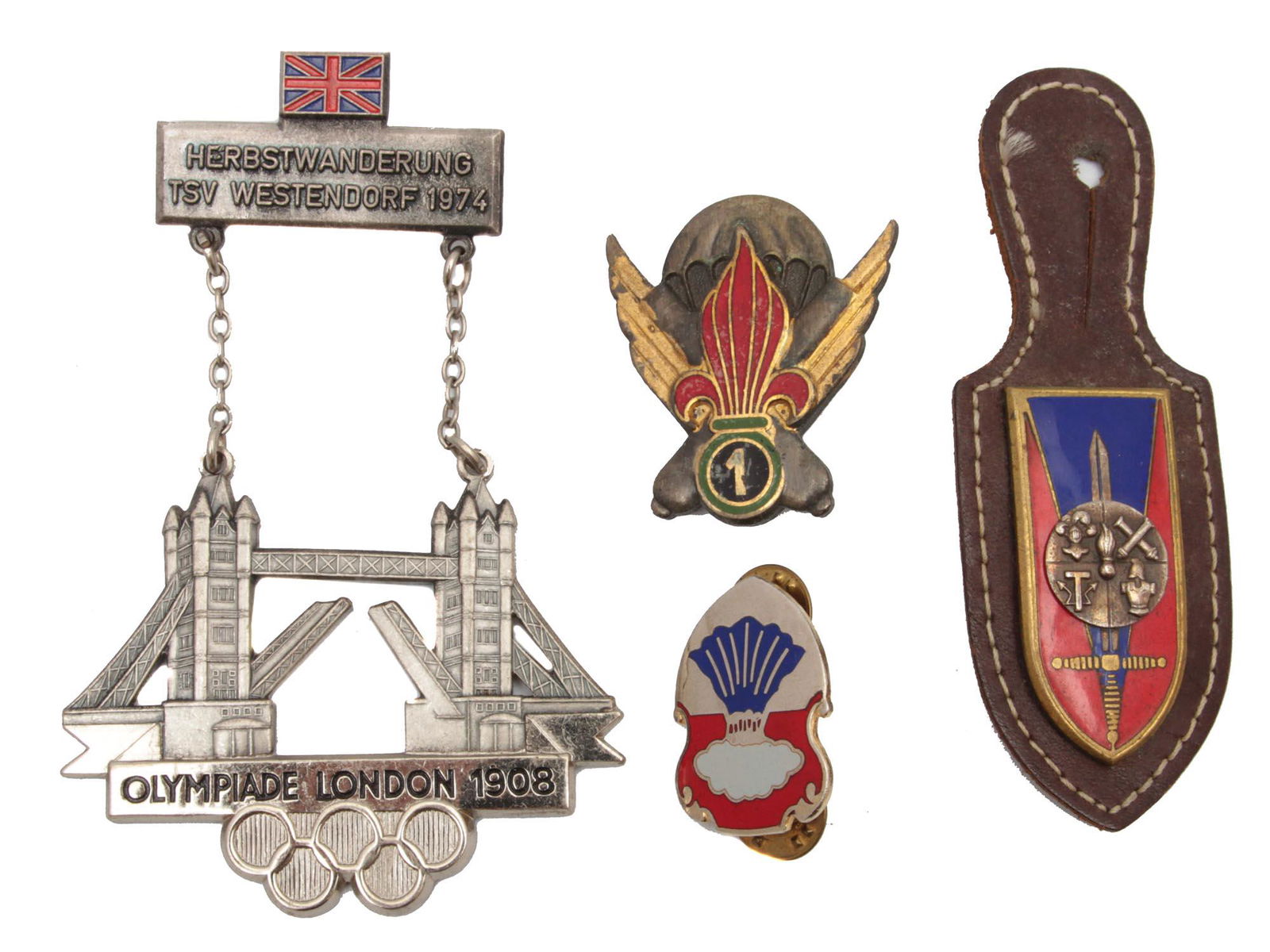 A LOT OF FOUR ANTIQUE MILITARY AND OLYMPIC BADGES (1 of 2)