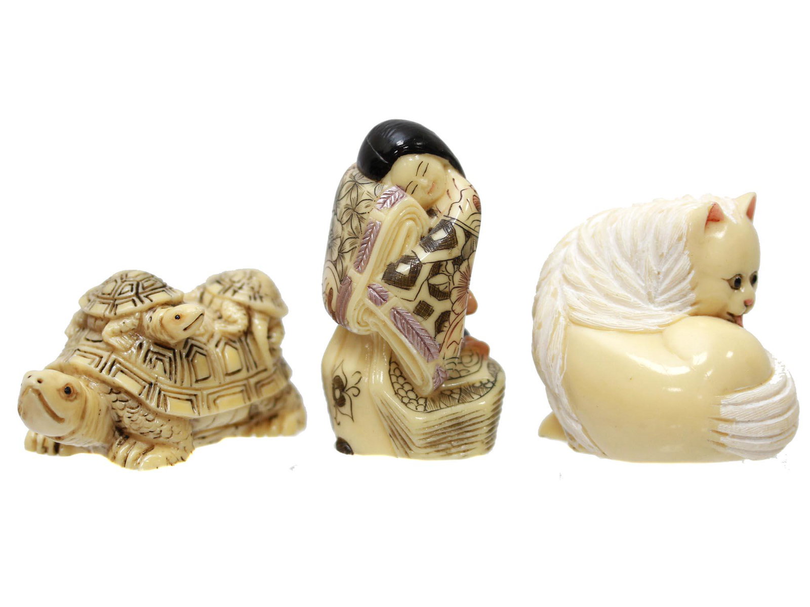 SET OF THREE ANTIQUE HAND CARVED JAPANESE NETSUKE: A set of three antique Japanese hand-carved, engraved, inked from natural materials netsuke. The first is depicting a turtle with a baby turtle on the tortoiseshell, two cord holes, and marked, on the