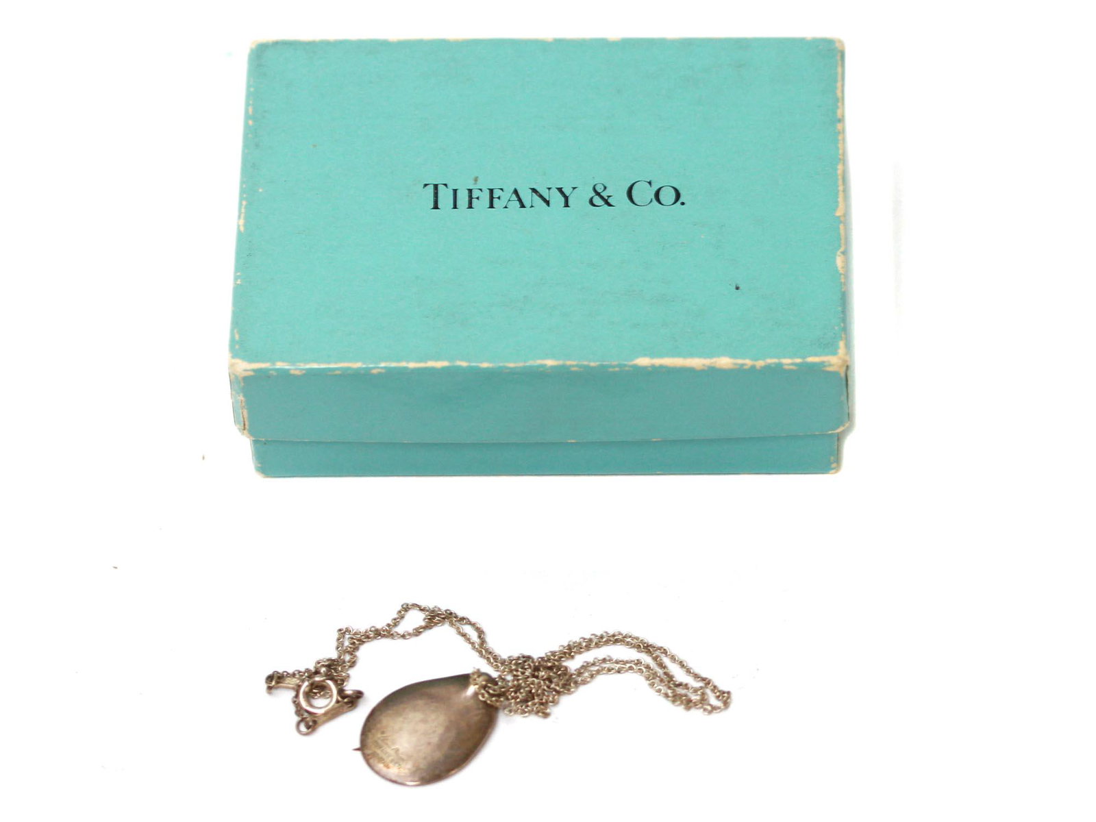 A TIFFANY & CO SILVER MADONNA PENDANT NECKLACE: A vintage stunning Tiffany & Co Sterling Silver chain necklace with a Madonna Pendant in the form of an embossed oval, designed by Elsa Peretti. Marked with Tiffany & Co, 925 Silver hallmarks, Spain m