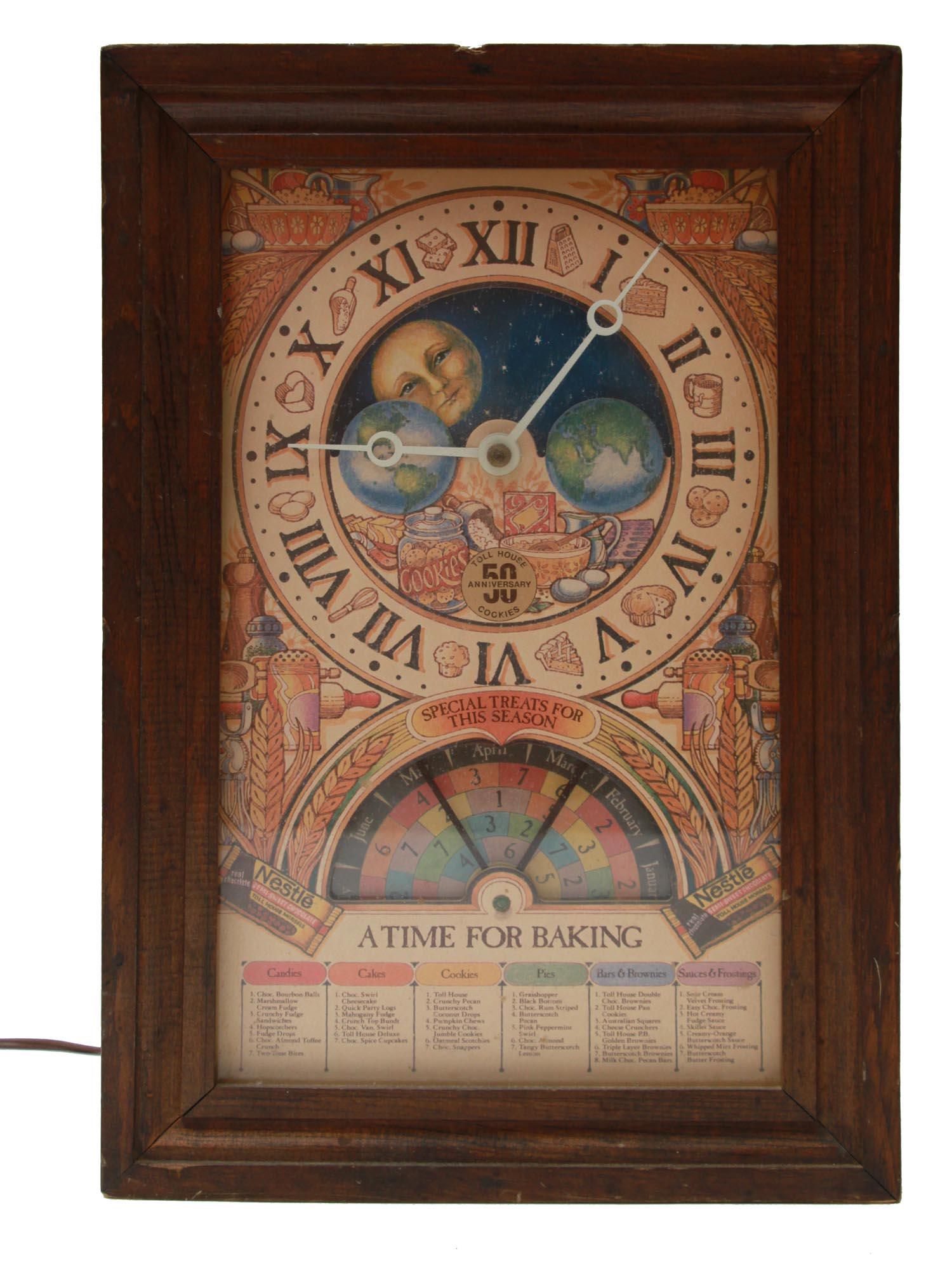 A VINTAGE MECHTRONICS CORPORATION BAKING CLOCK: A collectible Mechtronics Nestle clock, A Time for Baking. The clock was made in Stamford, Connecticut for Nestle with a seasonal baking guide that moves along with the moon and the seasons. There are