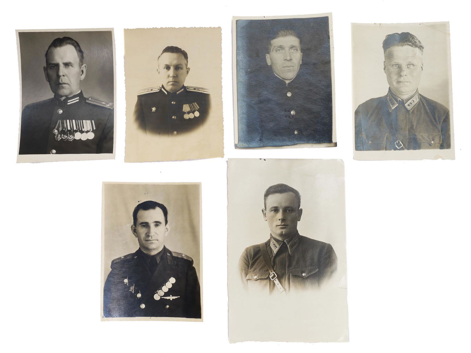 A SET OF 6 SOVIET ARMY OFFICER PHOTOGRAPHS: Lot contains seven original photographs, all photographs bear an official identification stamp with name of the person, rank and date. Photographs depict Soviet Russian military officials. Dimensions: