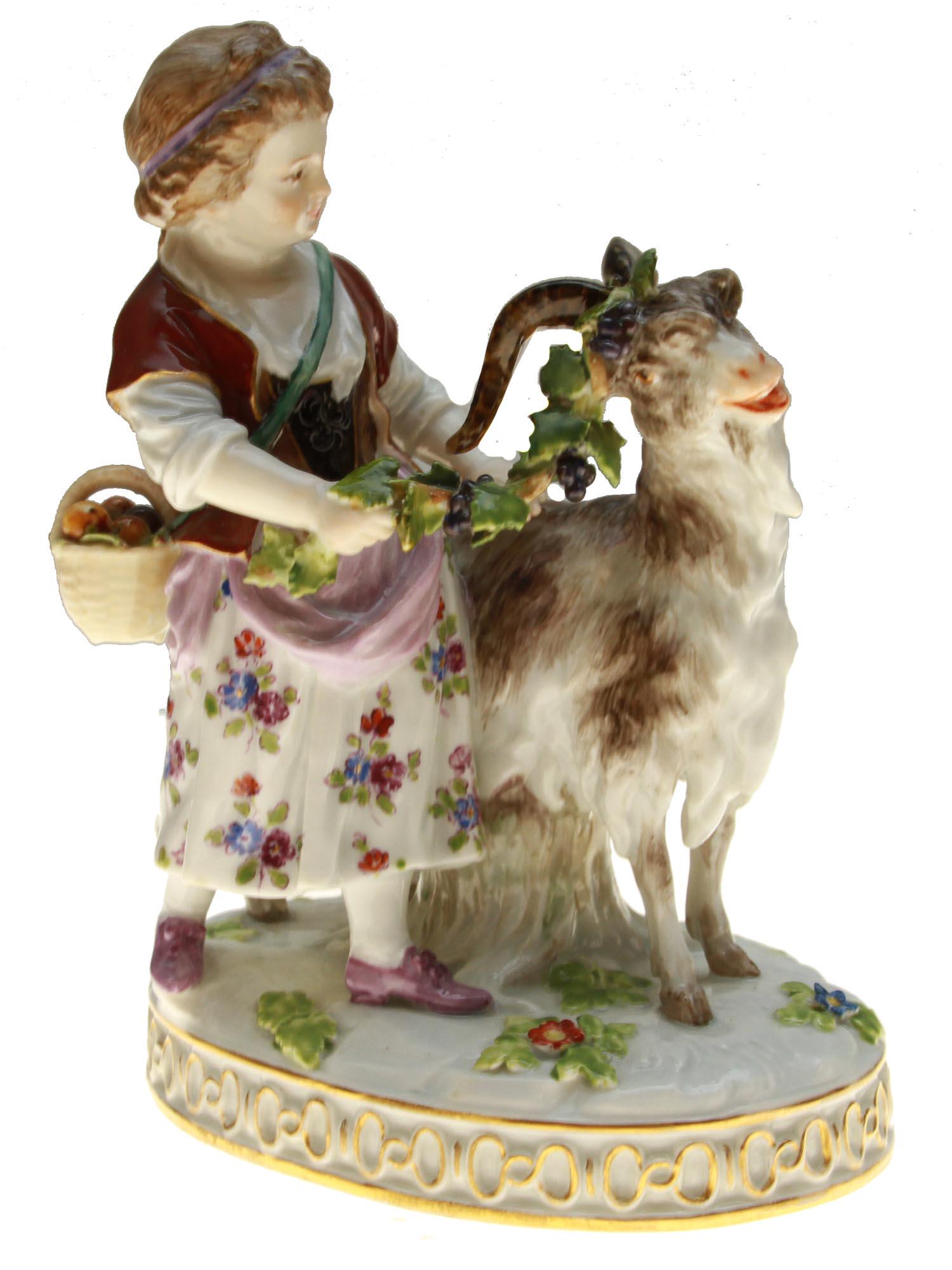 A MEISSEN PORCELAIN FIGURINE GIRL WITH GOAT, 1840: A Meissen porcelain figurine depicting a girl with a goat. This figure has been produced by Meissen since 1840. Designed by Johann Carl SchÃ¶nheit. Marked on the bottom with a Meissen factory stamp 