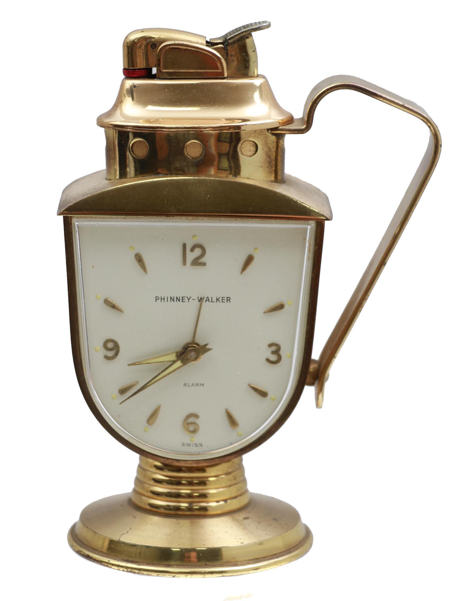 A PHINNEY WALKER RETRO ALARM CLOCK WITH A LIGHTER