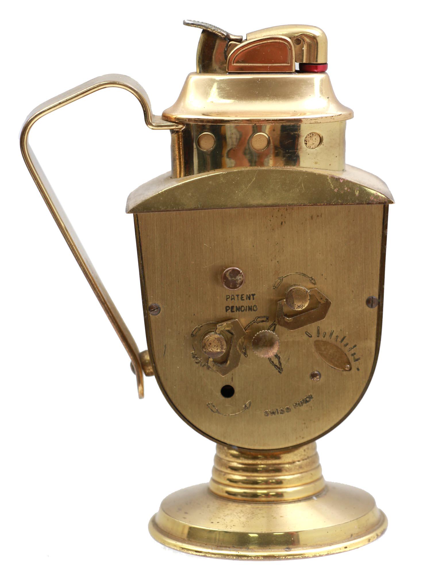 A PHINNEY WALKER RETRO ALARM CLOCK WITH A LIGHTER