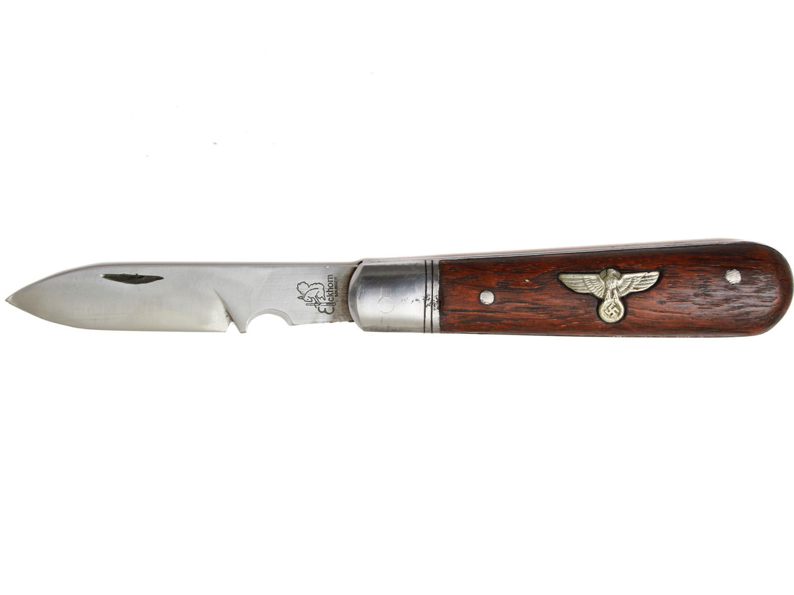 WWII GERMAN REICH EICKHORN SOLINGEN POCKET KNIFE: A WWII German NSDAP Party member's pocket knife by Eickhorn Solingen. A wooden handle is adorned with an eagle swastika insignia. Marked with a logo and Eickhorn Solingen, on the blade. Dimensions: Op