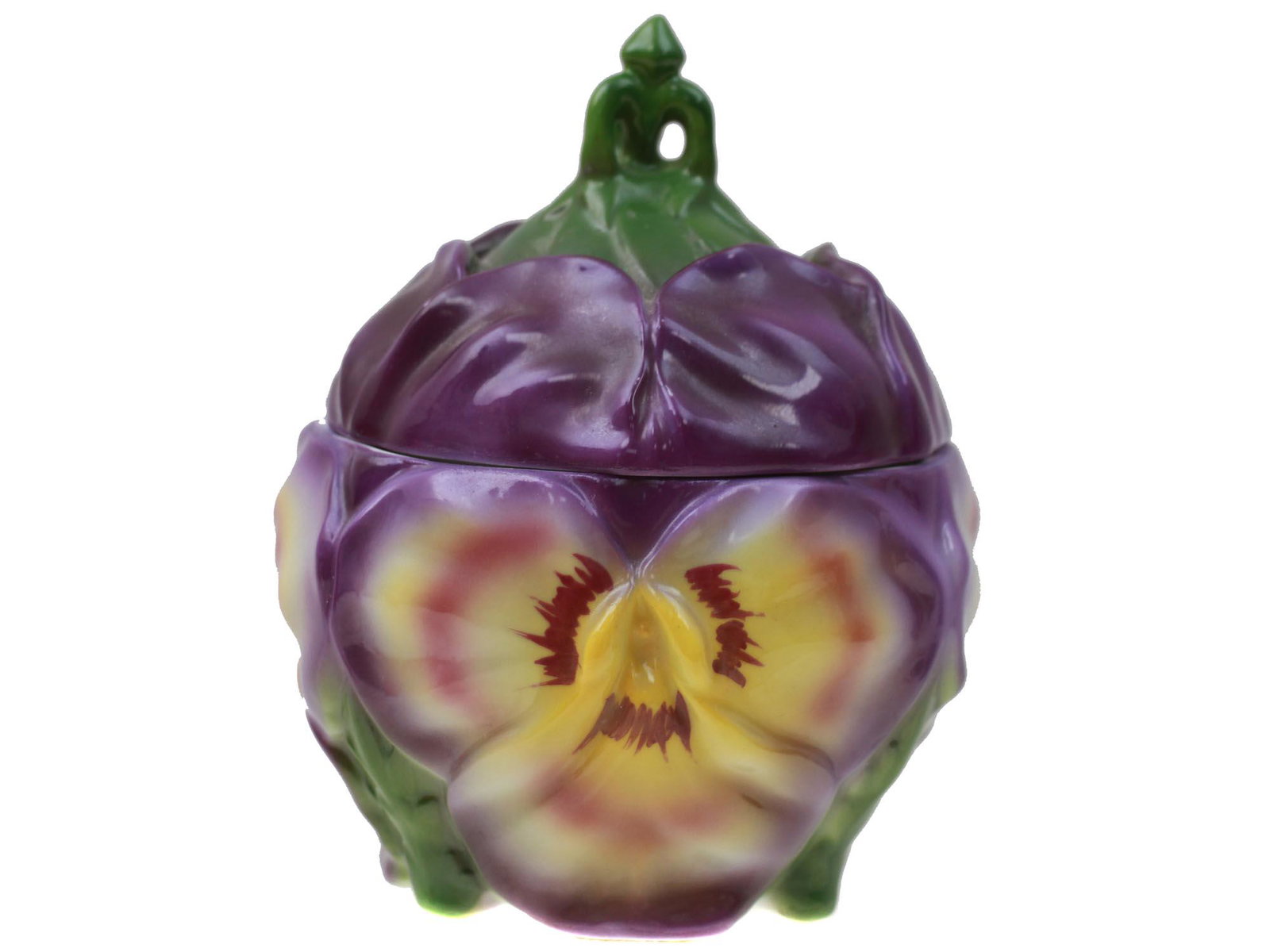 A BAVARIAN PORCELAIN PANSY COVERED SUGAR BOWL: Bavarian porcelain covered sugar bowl in the form of pansy in purple, yellow and green shades. Marked, Bavaria, on the bottom. Circa: the early 20th century. Dimensions: H: 5 1/4 in.