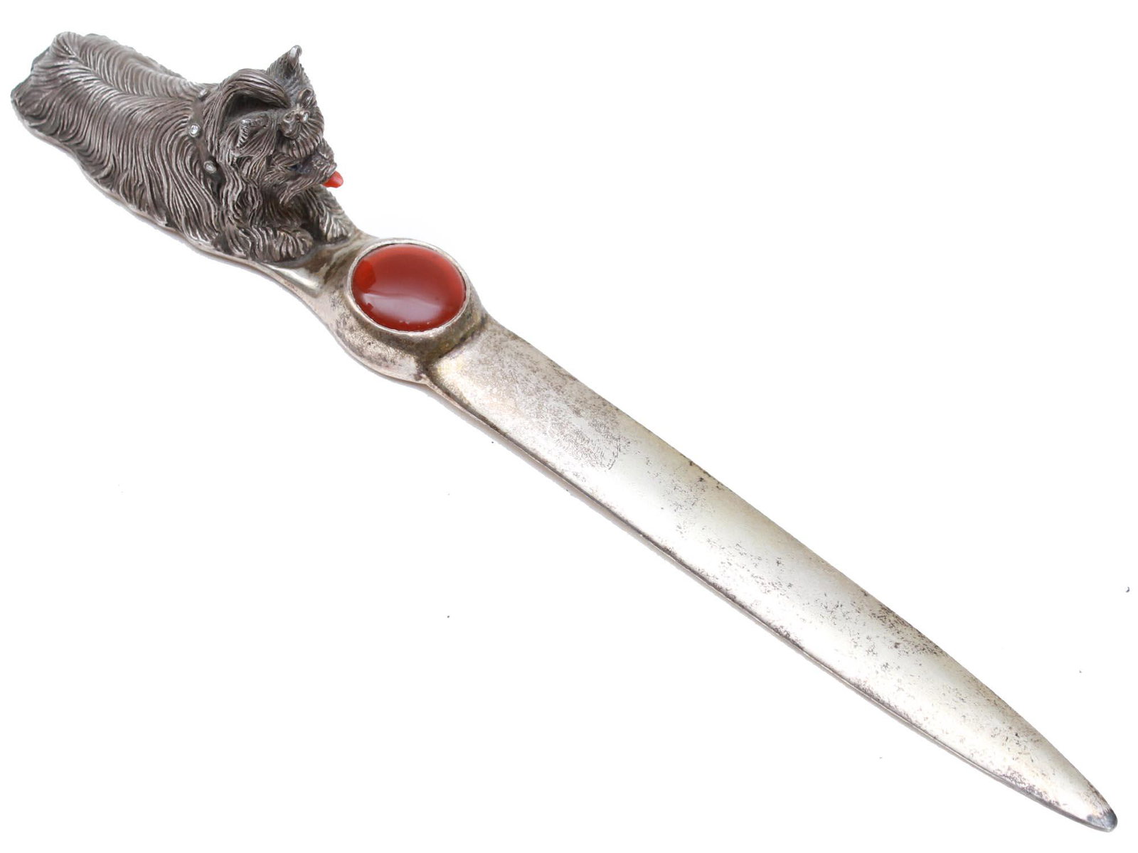 FIGURAL STERLING SILVER & DIAMONDS LETTER OPENER: A graceful sterling silver letter opener with a handle in the form of a Yorkshire Terrier dog figurine adorned with a coral mouth and a collar inlaid with diamond. A lower part of the handle is adorne