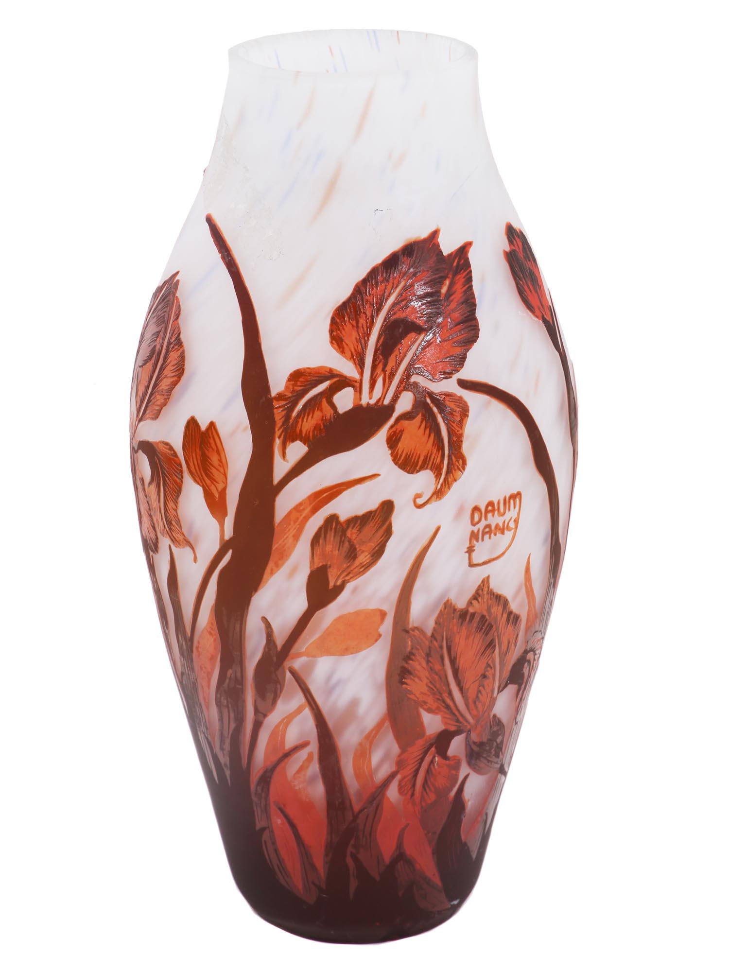 A VINTAGE AFTER DAUM NANCY CAMEO GLASS VASE: A beautiful vintage AFTER Daum Nancy Art Nouveau style cameo glass vase decorated with ochre irises on a white background. Signed: Daum Nancy. Dimensions: H: 12" in.