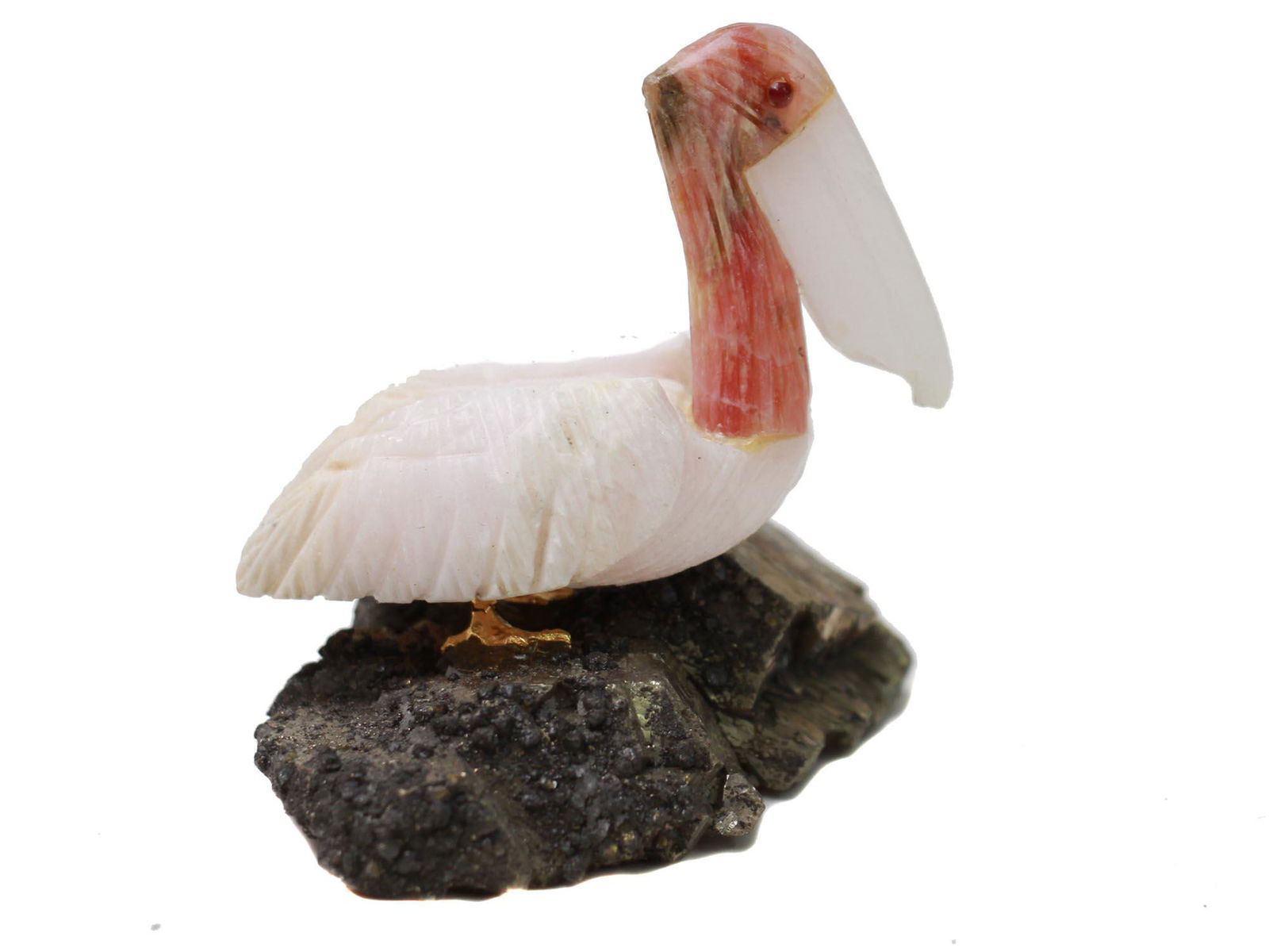 A VINTAGE HAND-CARVED FIGURINE OF A PELICAN (1 of 5)