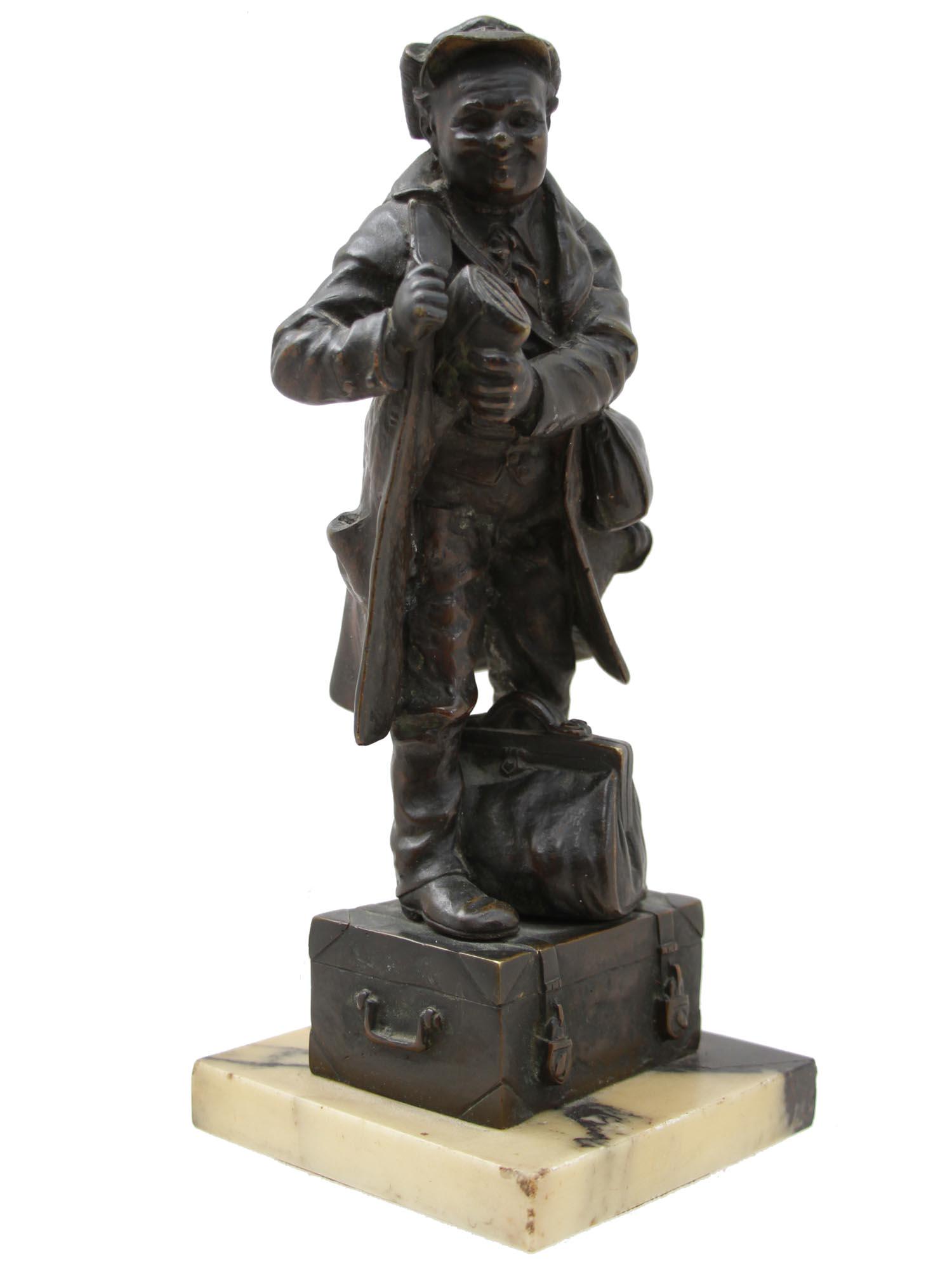 AN ANTIQUE BRONZE FIGURINE OF A MAN ON THE CHEST (1 of 9)