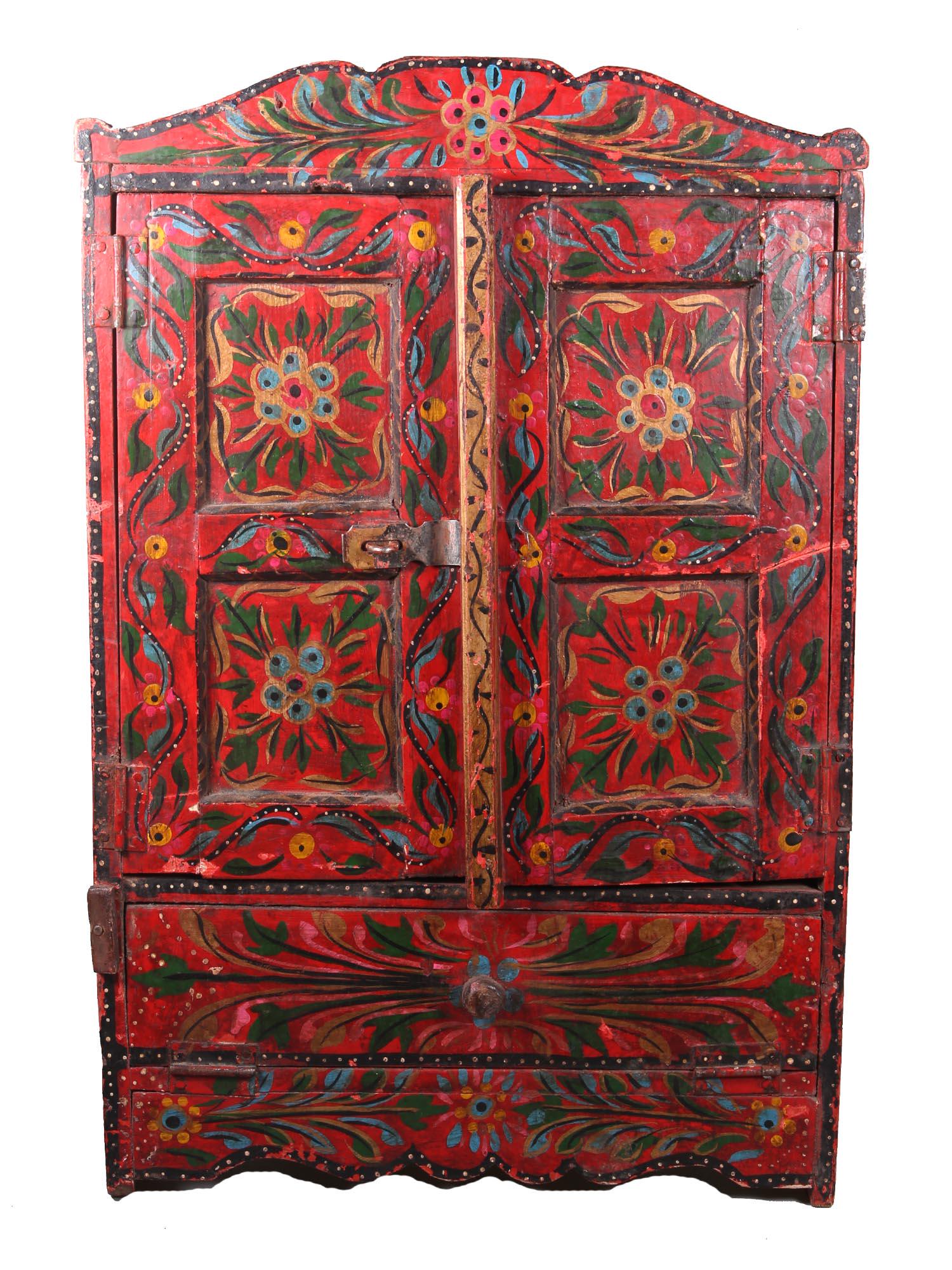 A VINTAGE NORTH AFGHANISTAN PAINTED WOOD CABINET: Cabinet with two doors and a drawer. Decorated with bright floral motifs beautifully hand-painted on wood. Dimensions: L 12 3/4 x W 6 1/4 x H 19 3/4 in.