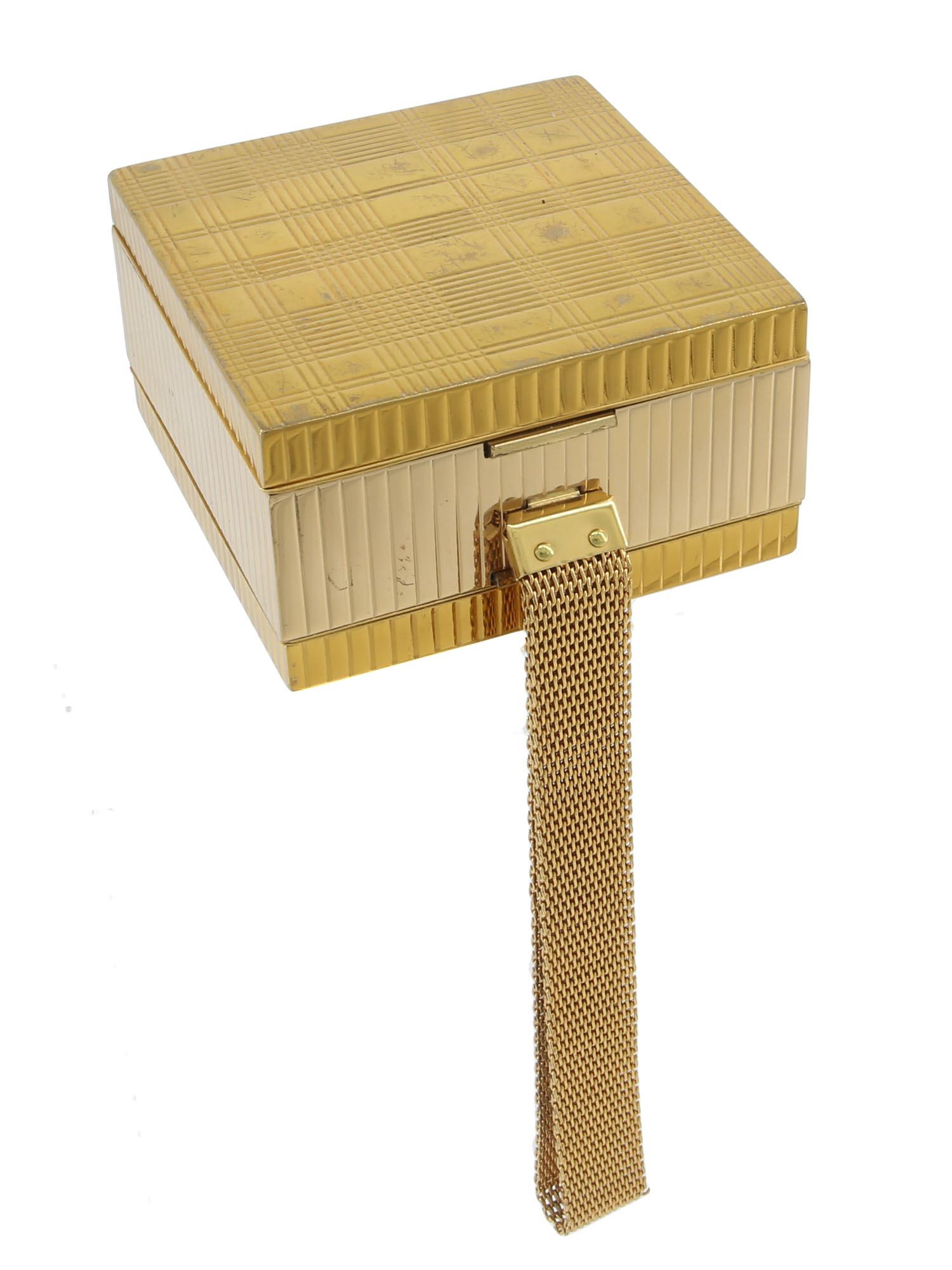 A VINTAGE DOUBLE SIDED EVANS COMPACT SET: A rare vintage Evans rhinestone carryall minaudiere compact. A Clutch, a purse, a cigarette case, a lighter, a powder, a lipstick, and a mirror, all in one. Circa: the 1940s. Dimensions: 3 1/8" x 3 1/